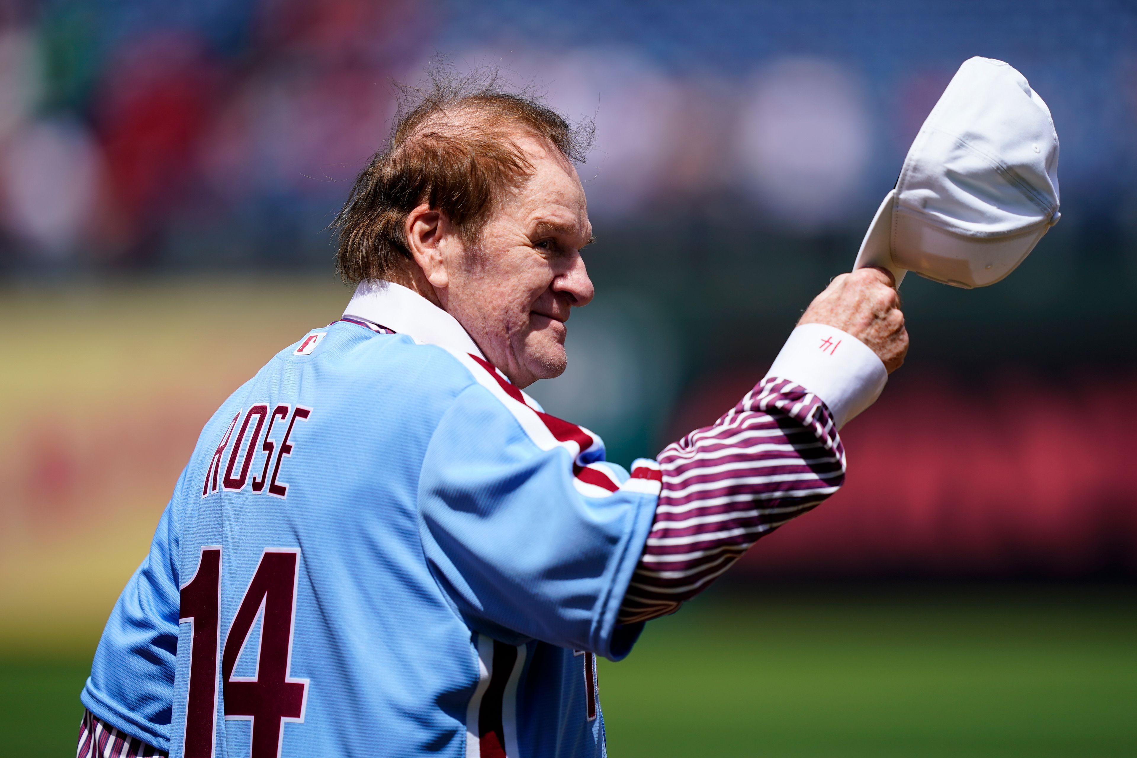 FILE - Former Philadelphia Phillies player Pete Rose tips his hat to fans during an alumni day, Aug. 7, 2022, in Philadelphia. (AP Photo/Matt Rourke, File)