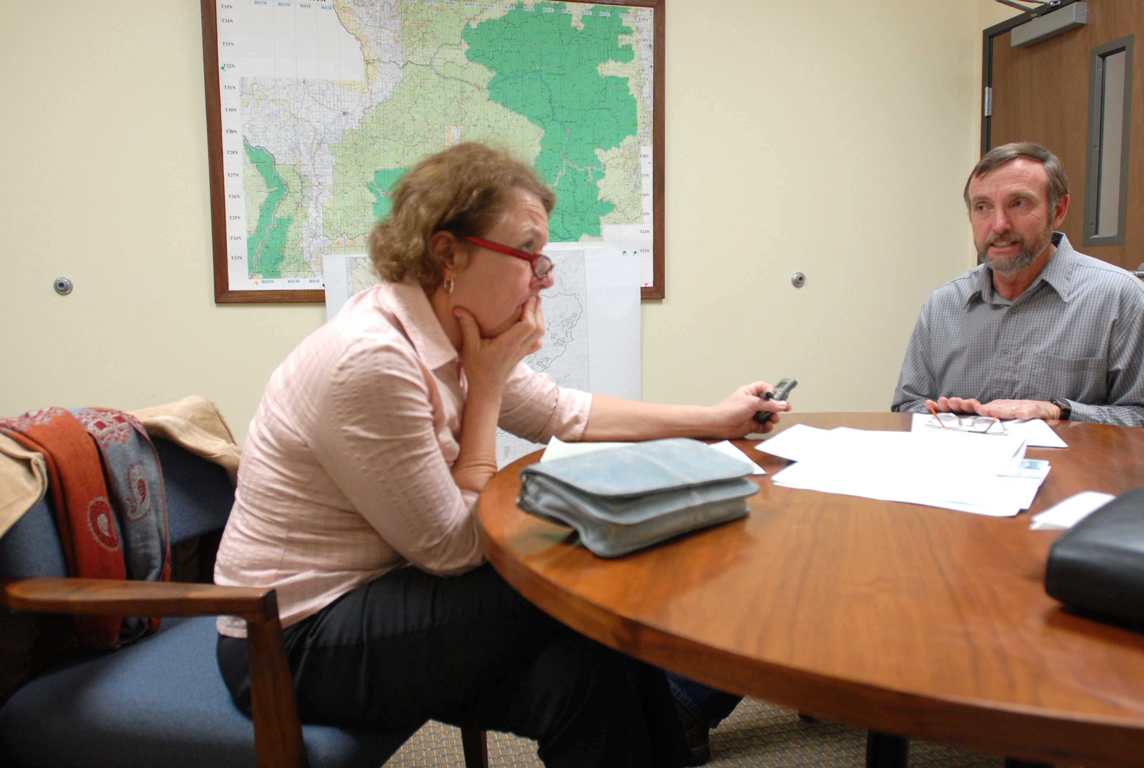 Kathy Hedberg, left, interviews an official.