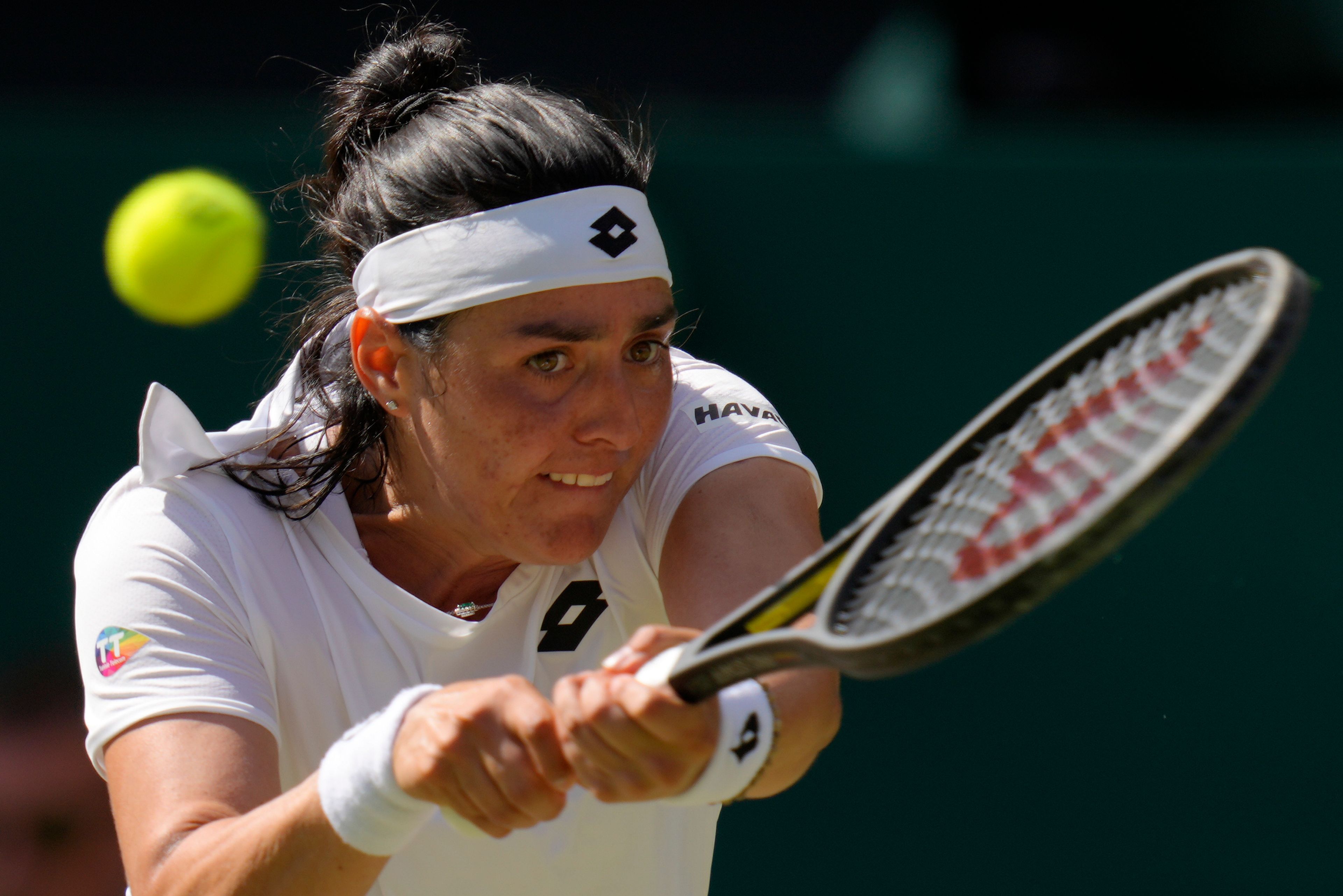 Tunisia's Ons Jabeur returns to Kazakhstan's Elena Rybakina in the final of the women's singles on day thirteen of the Wimbledon tennis championships in London, Saturday, July 9, 2022. (AP Photo/Kirsty Wigglesworth)