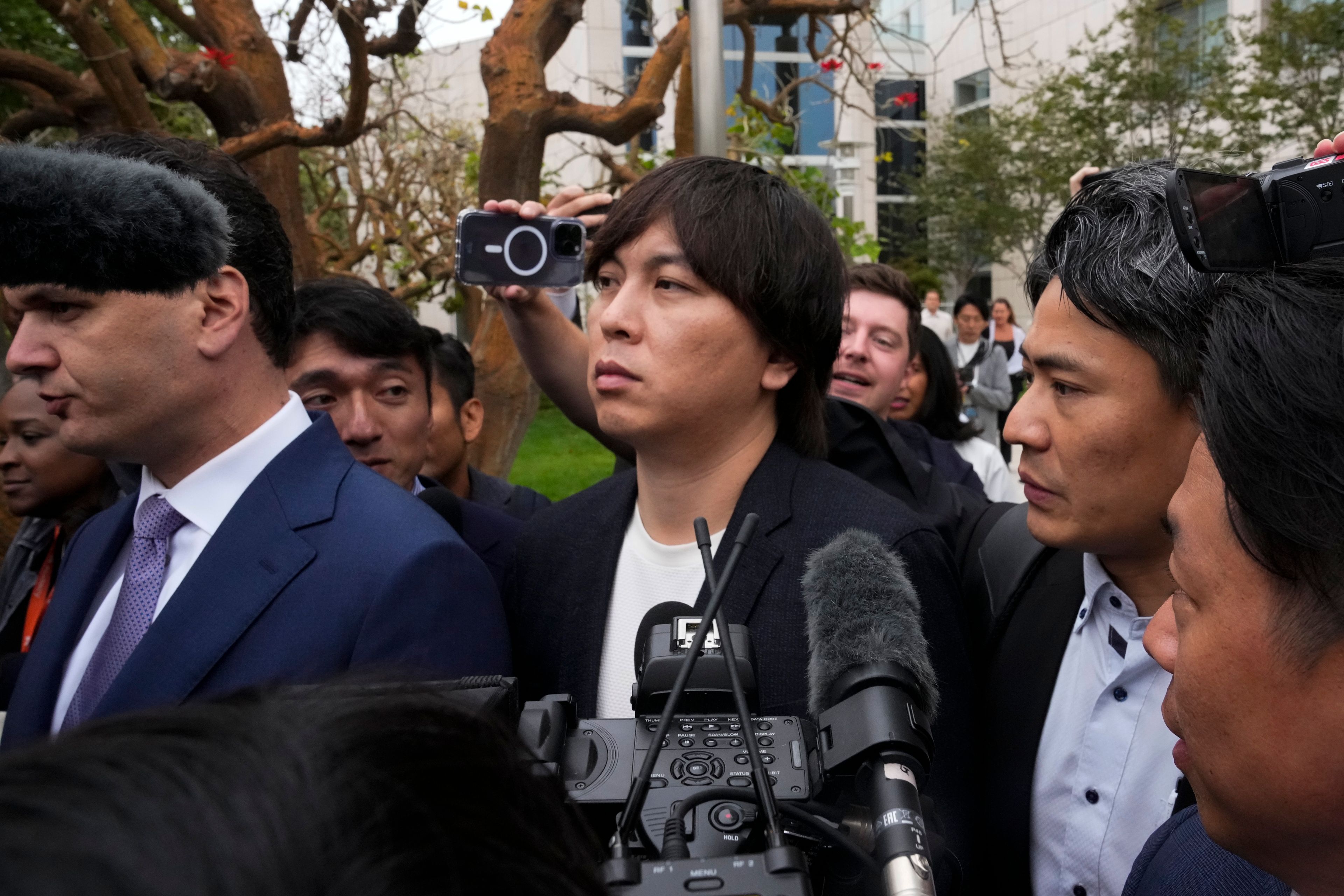 Ippei Mizuhara, the former interpreter for the Los Angeles Dodgers baseball star Shohei Ohtani, leaves federal court in Los Angeles, Tuesday, June 4, 2024, after pleading guilty to bank and tax fraud in a sports betting case.