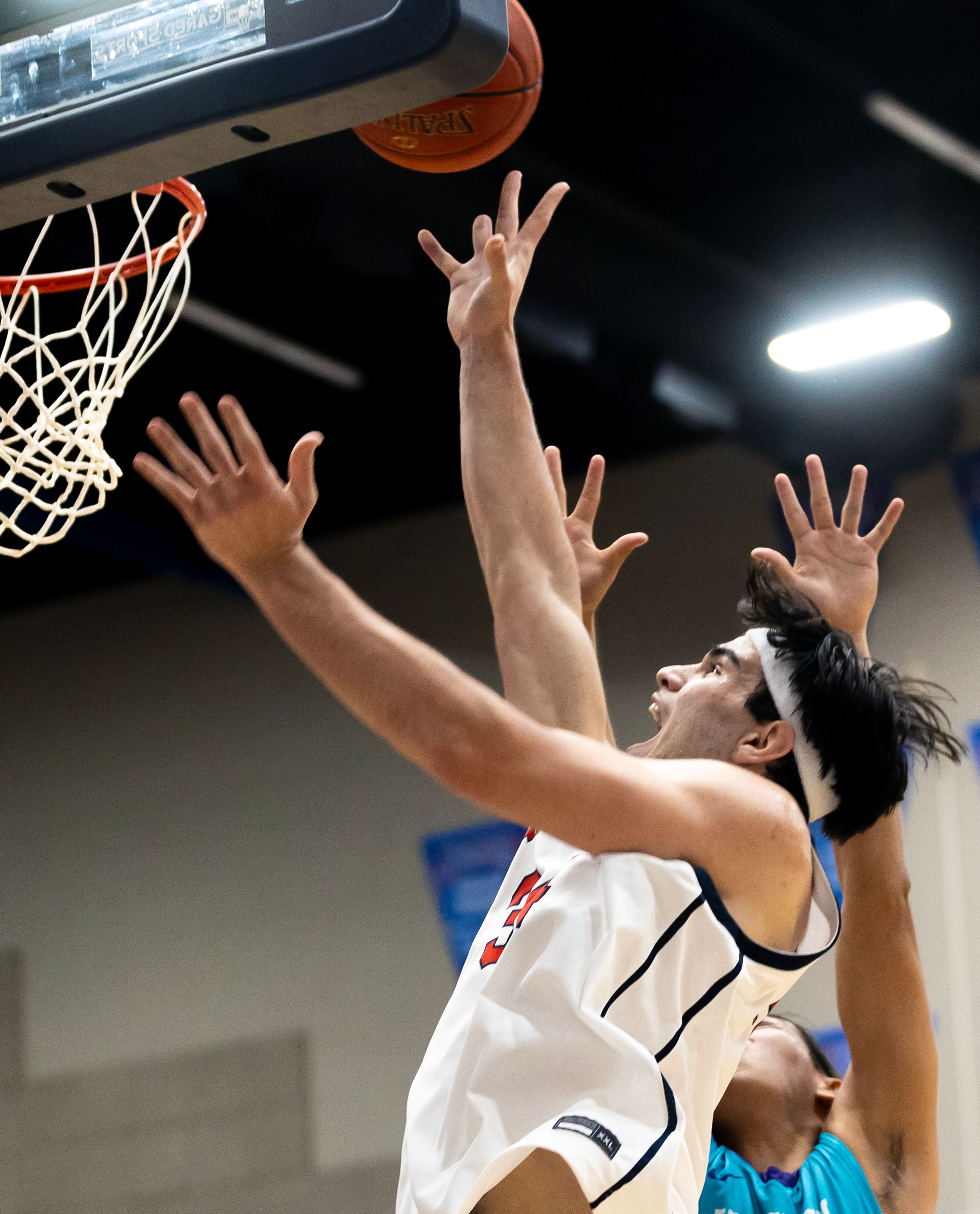 Lewis-Clark State forward Josh Salguero shoots a layup against Haskell during the season opening game as part of Tribal Nations Weekend Saturday in Lewiston.,