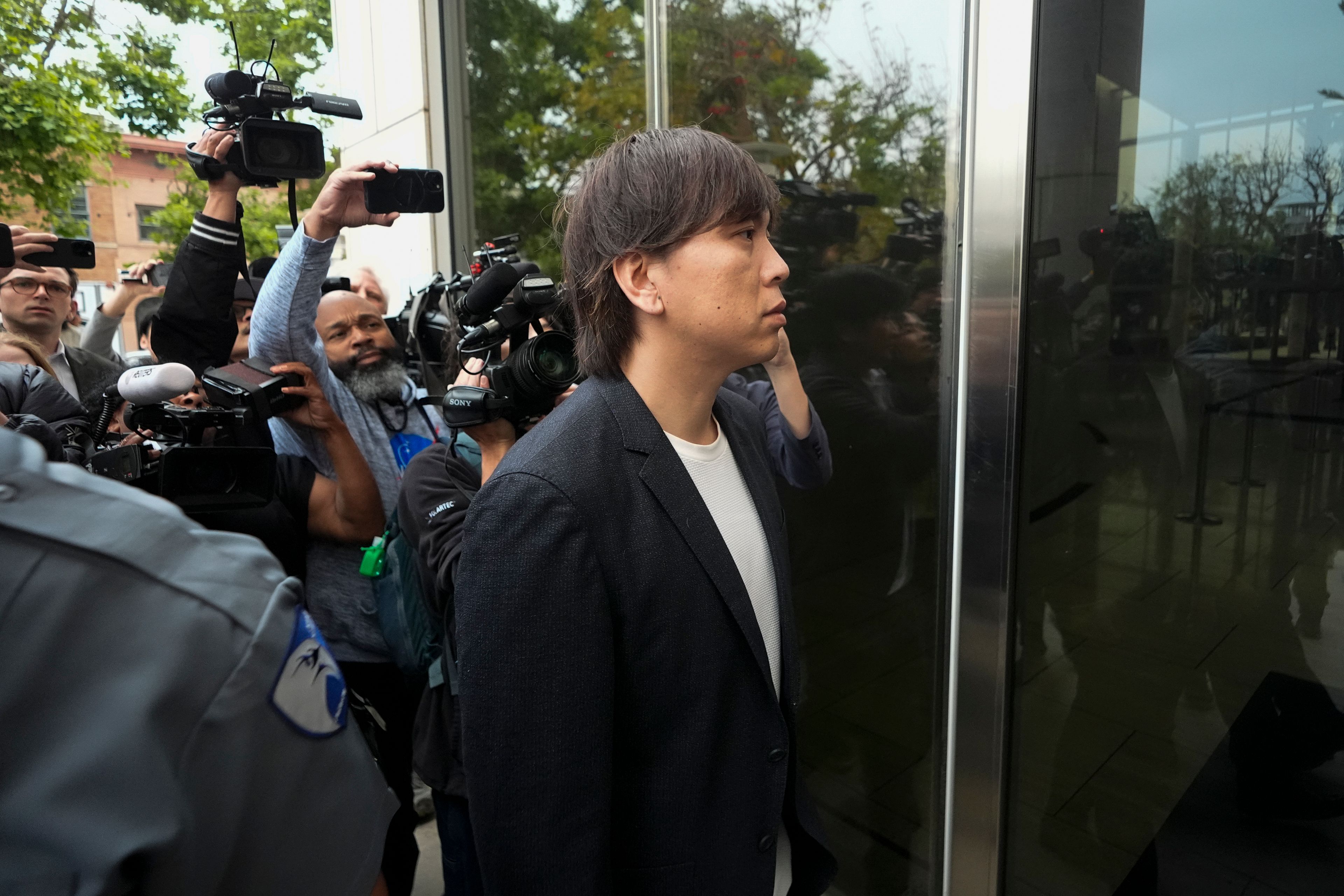 Ippei Mizuhara, the former interpreter for the Los Angeles Dodgers baseball star Shohei Ohtani, arrives at federal court in Los Angeles, Tuesday, June 4, 2024. Mizuhara is scheduled to plead guilty Tuesday to bank and tax fraud in a sports betting case where he is expected to admit to stealing nearly $17 million from the Japanese baseball player.