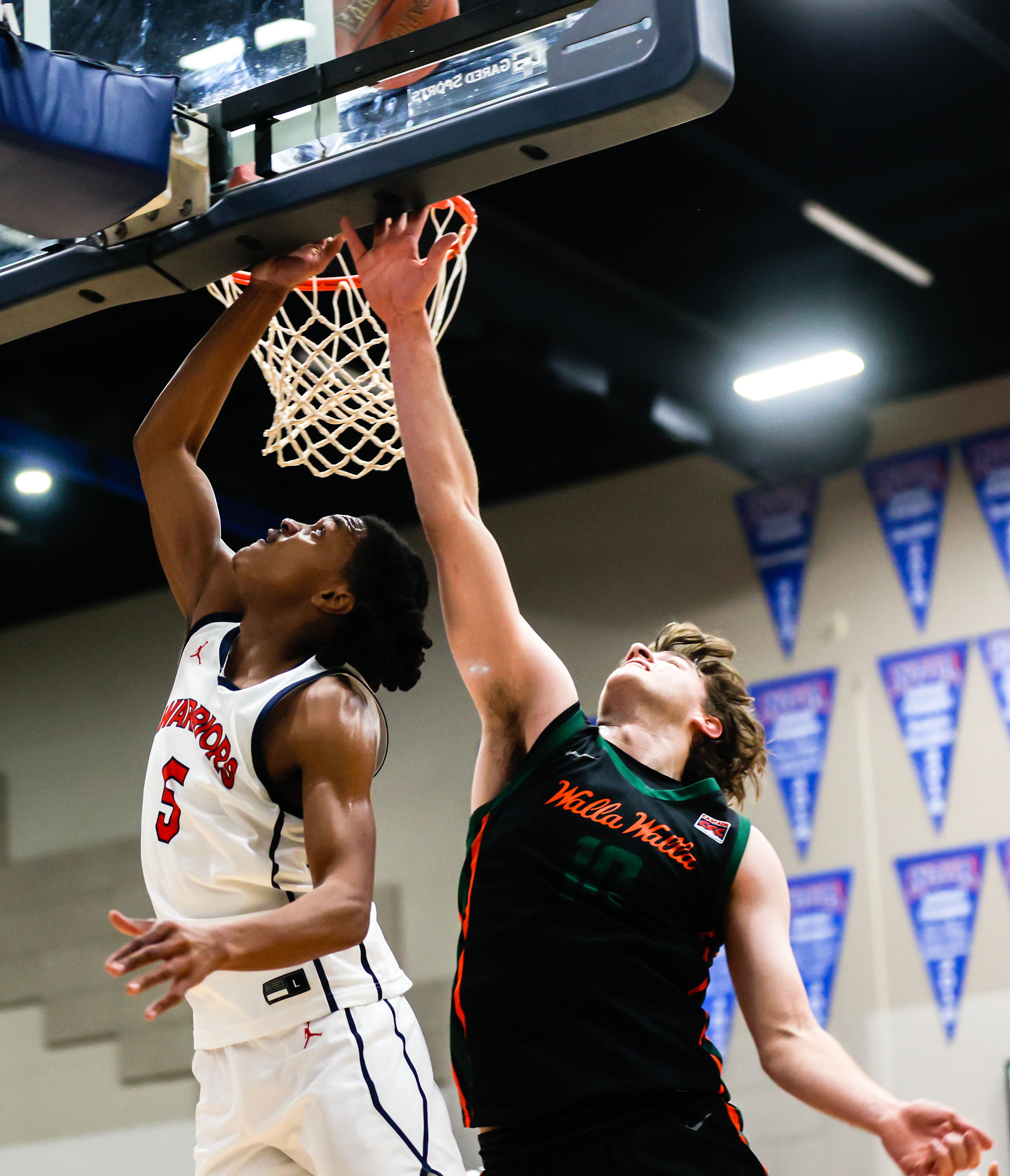 Lewis-Clark State guard Gorden Boykins shoots the ball as Walla Walla guard Thomas Mestrov guards him during a quarter of a Cascade Conference game Tuesday at Lewis-Clark State College in Lewiston.