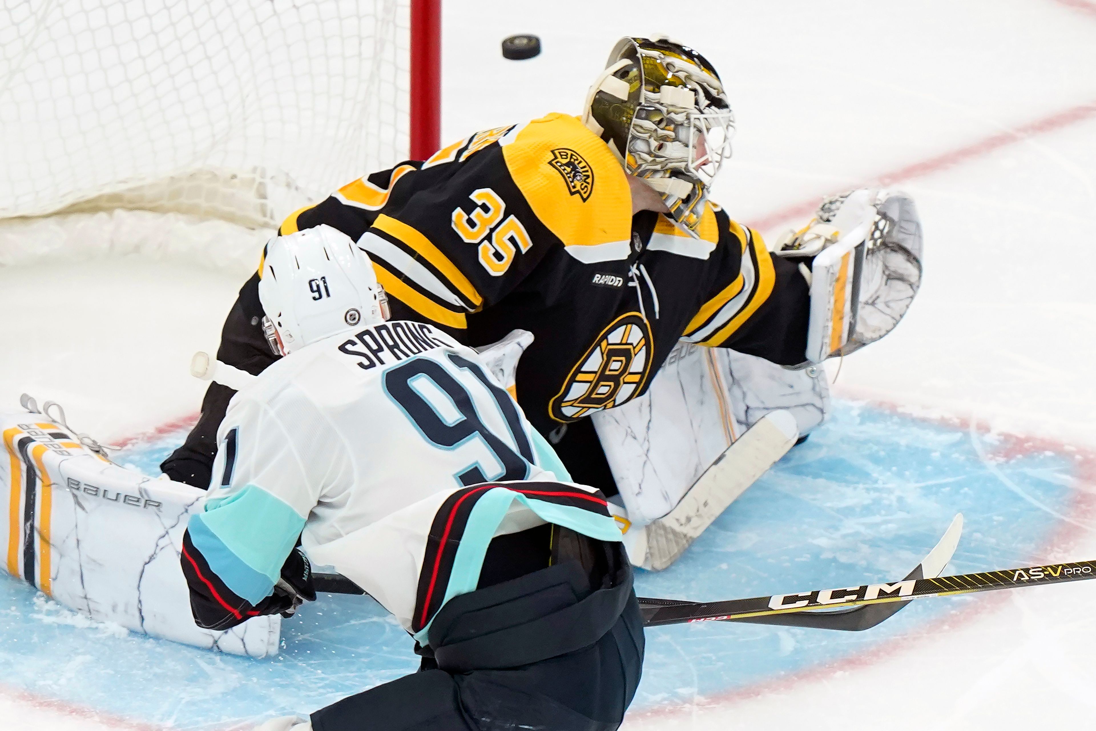 Seattle Kraken right wing Daniel Sprong (91) is unable to get the puck past Boston Bruins goaltender Linus Ullmark (35) in the third period of an NHL hockey game, Thursday, Jan. 12, 2023, in Boston. (AP Photo/Steven Senne)