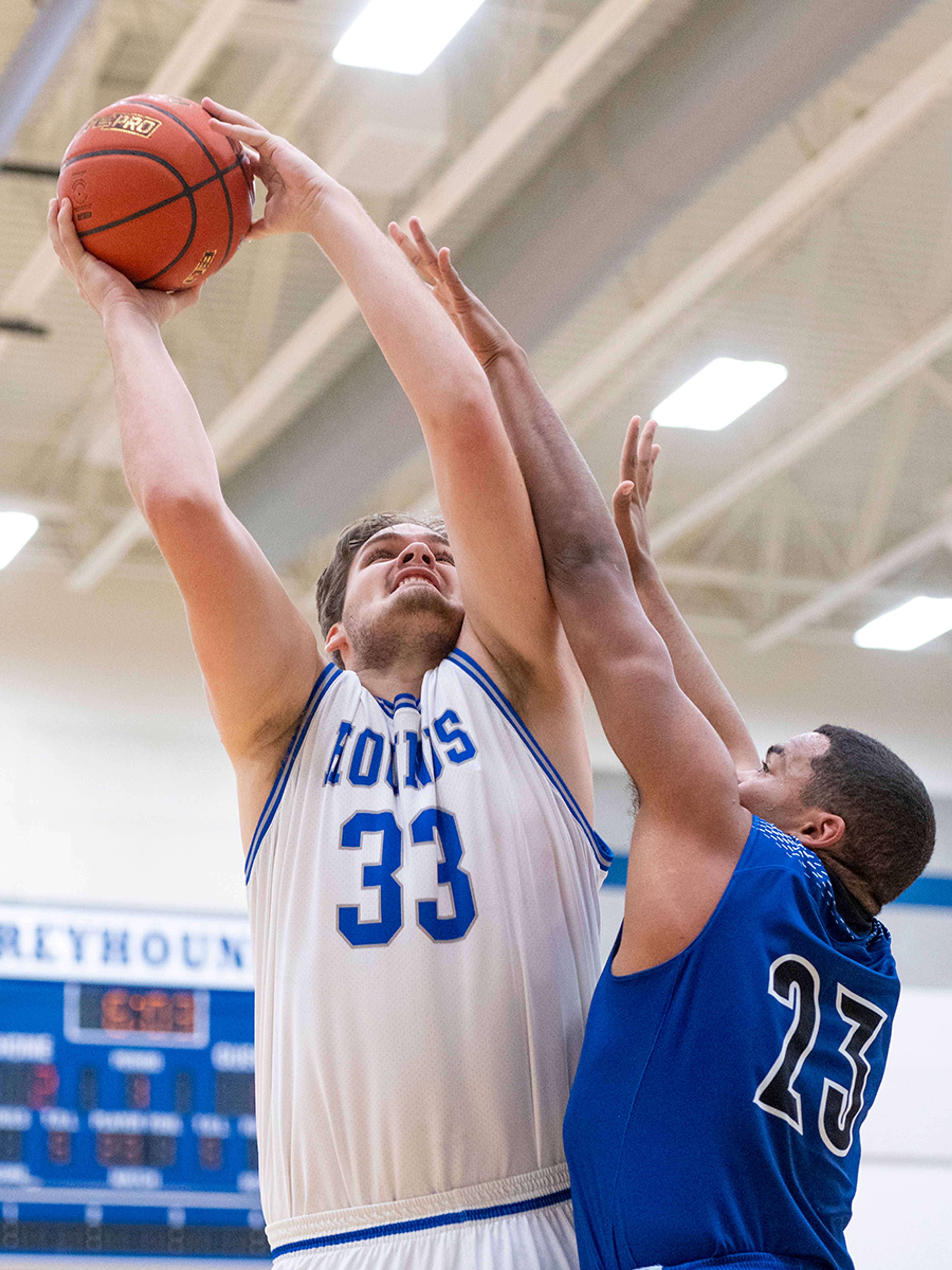 Pullman center Austin Hunt, left, is fouled by Lakeside forward Zeshawn Griffin during Friday's nonleague game.