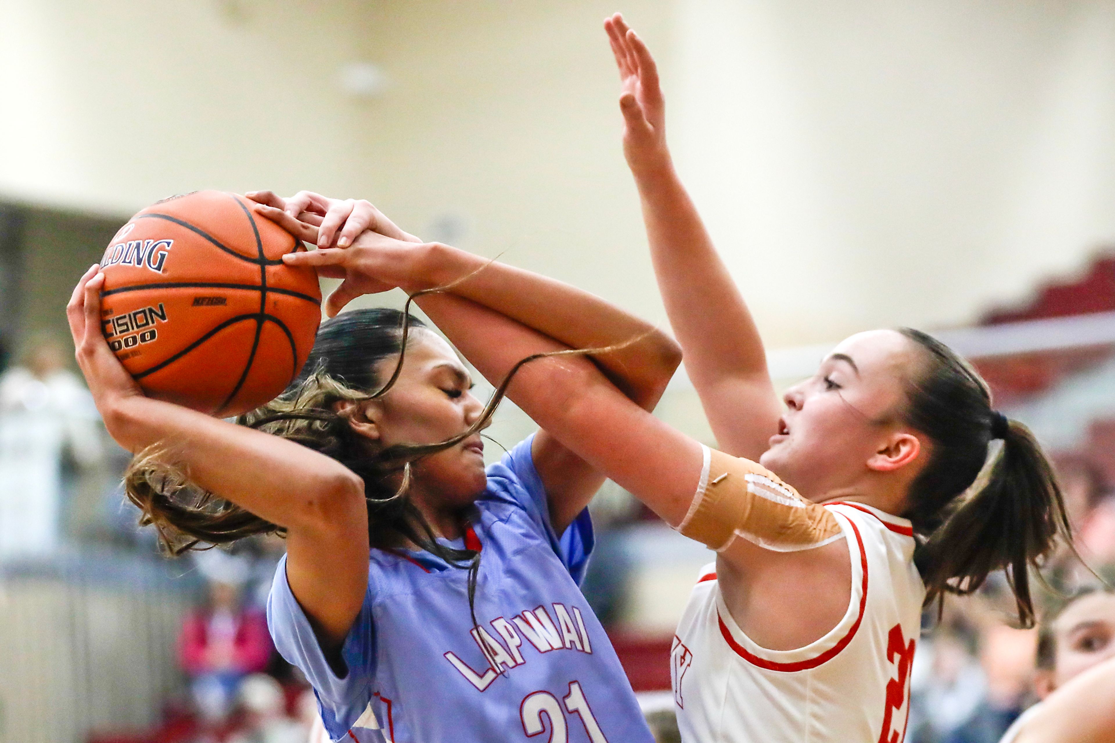 Lapwai's Jayden Leighton, left, keeps the ball away from Oakley forward Makaye Cranney, right, during an Idaho Class 1A DI girls state semifinal game Friday at Columbia High School.