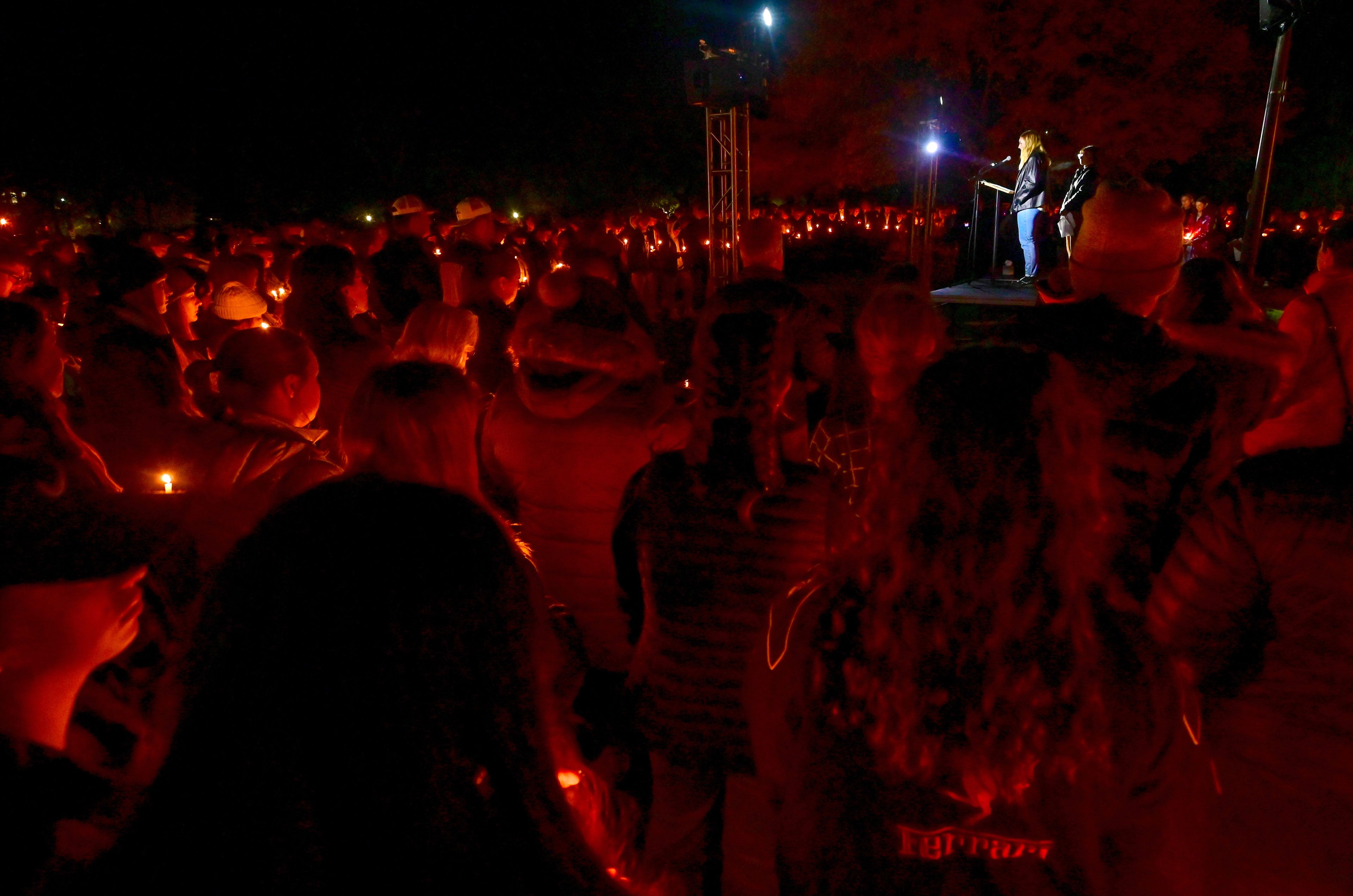 Students, staff and community members gather for a vigil in memory of the four University of Idaho students killed a year before in a quadruple homicide in Moscow. Zanna Miller, center, shares memories of friend Xana Kernodle, one of the four students killed, during the vigil on campus Monday.