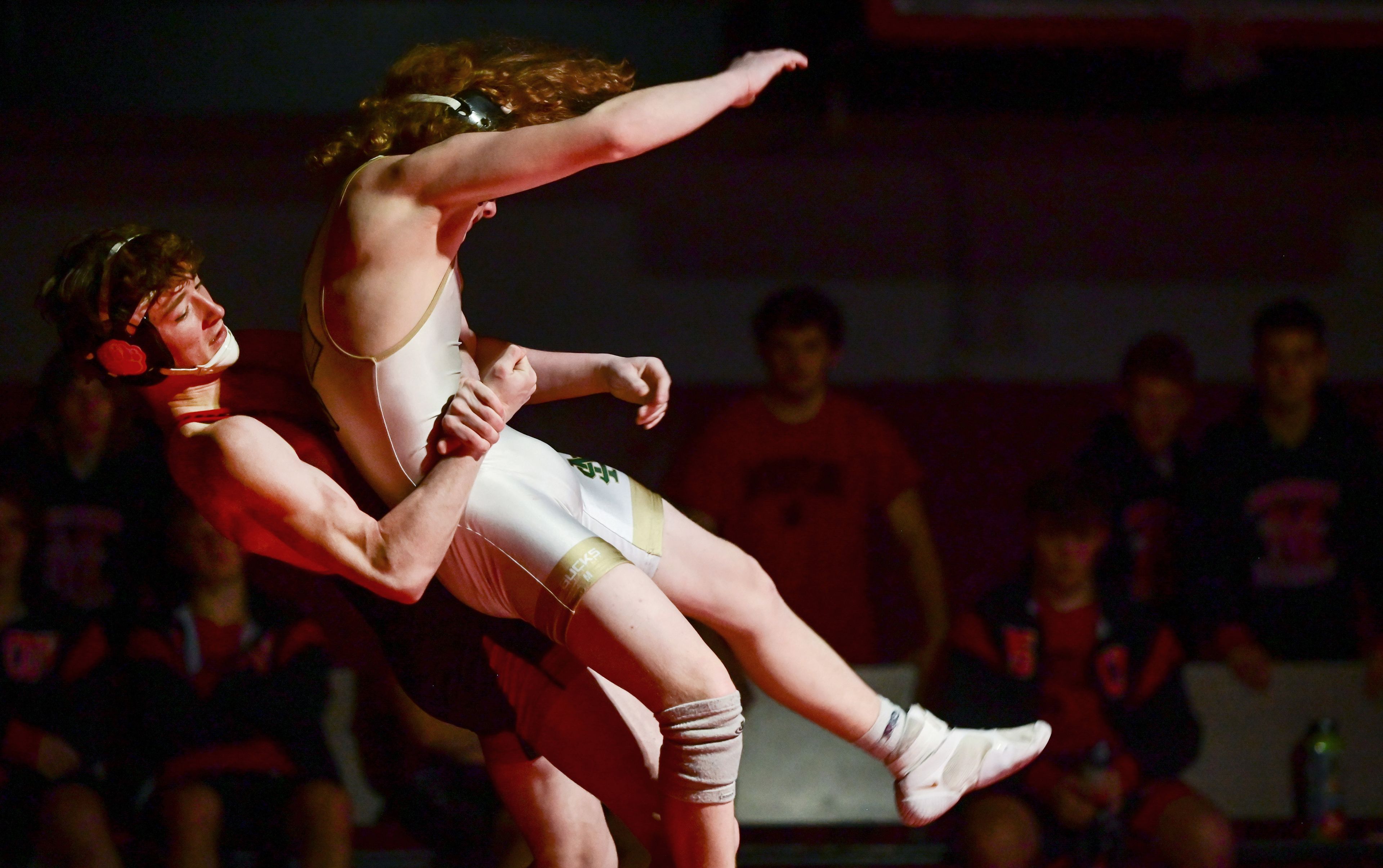 Moscow’s Jason Swam lifts St. Maries’ Landon Tweedy during a match Thursday at Bear Den in Moscow.