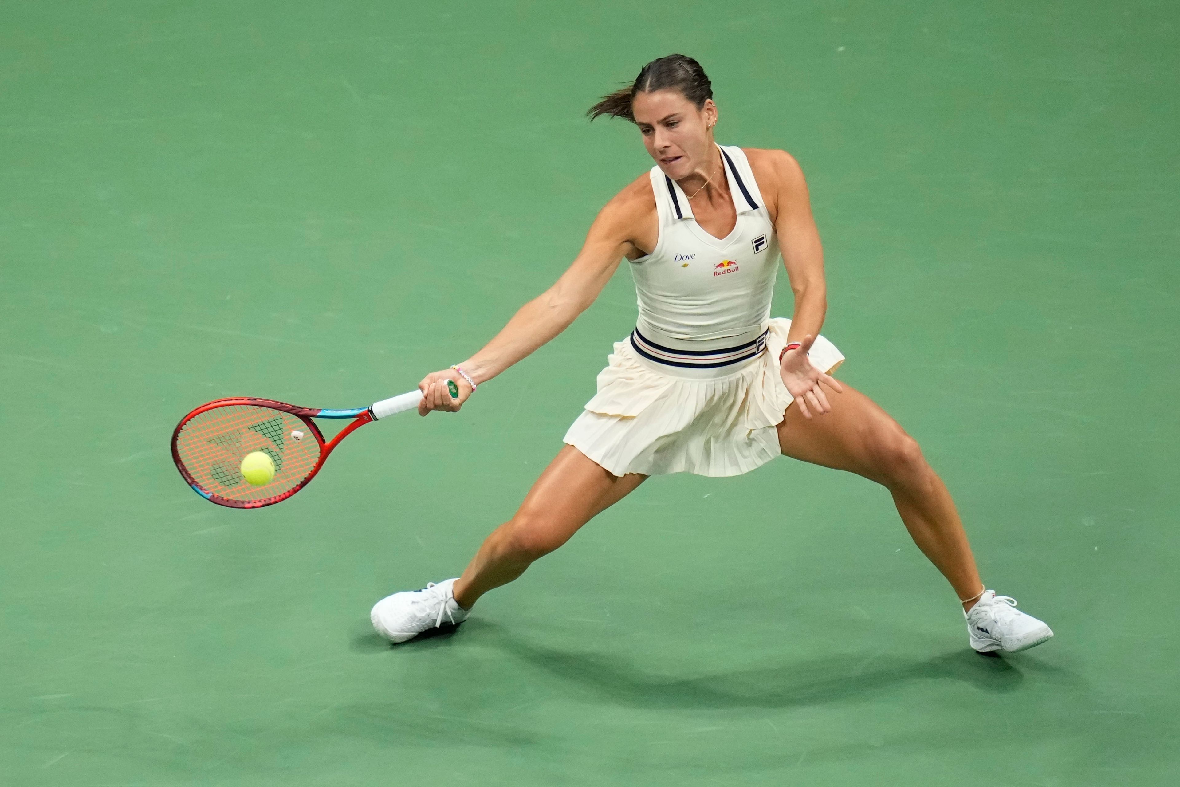 Emma Navarro, of the United States, returns a shot to Aryna Sabalenka, of Belarus, during a semifinal match of the U.S. Open tennis championships, Thursday, Sept. 5, 2024, in New York.