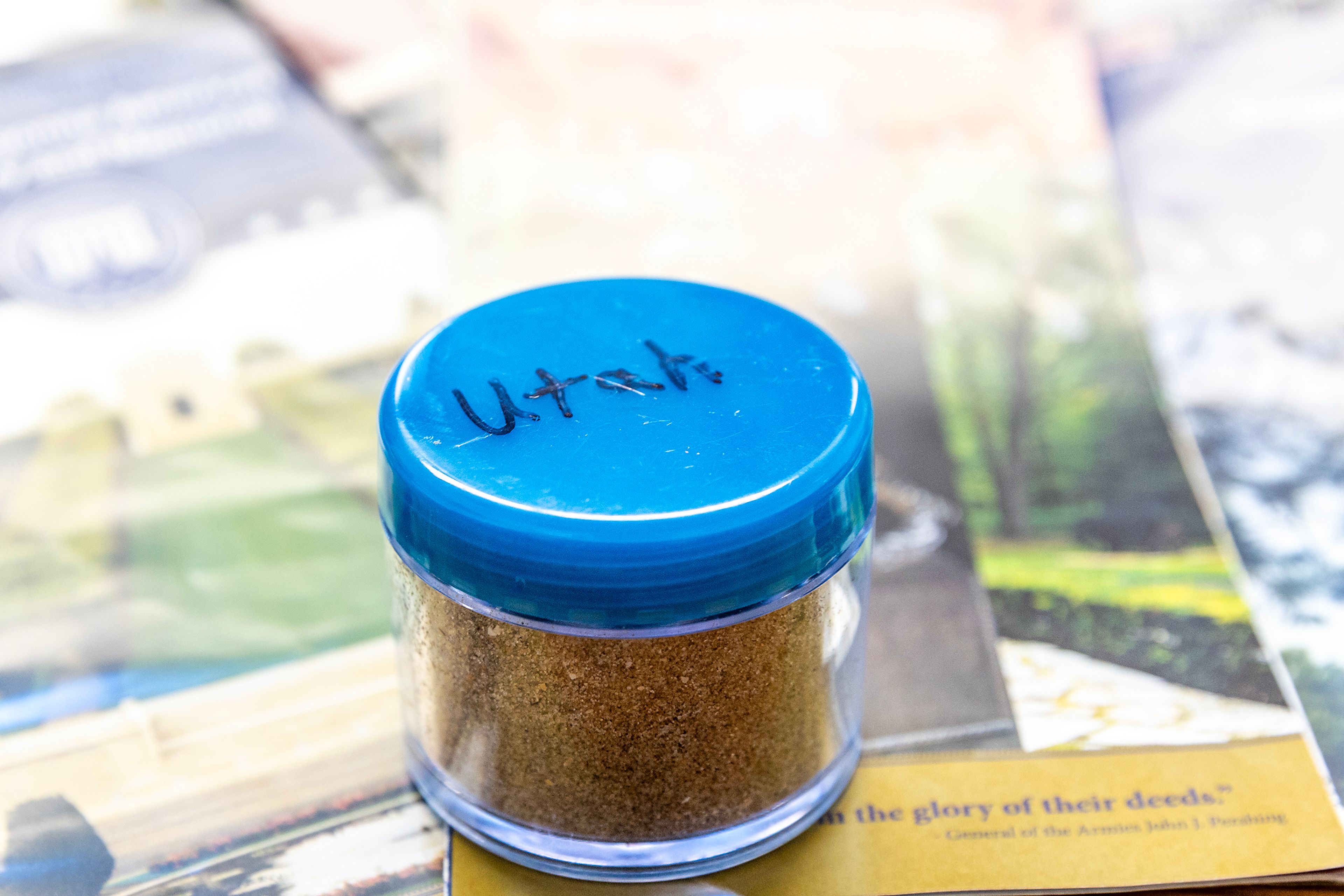 Sand from Utah Beach is pictured in a container Tuesday in Lewiston.