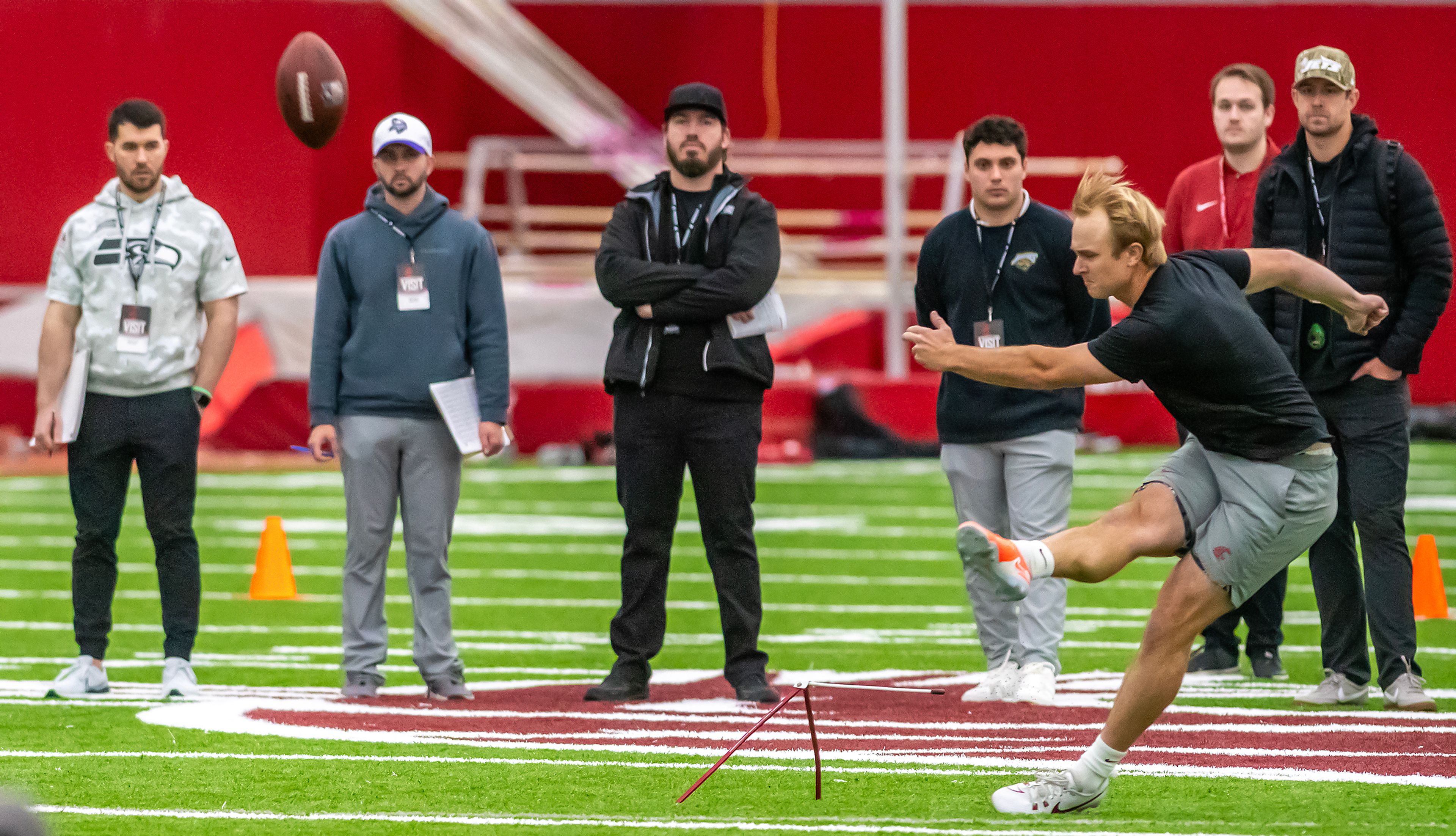 Scouts watch as Washington State kicker Dean Janikowski kicks the ball during WSU's Pro Day on Friday in Pullman.