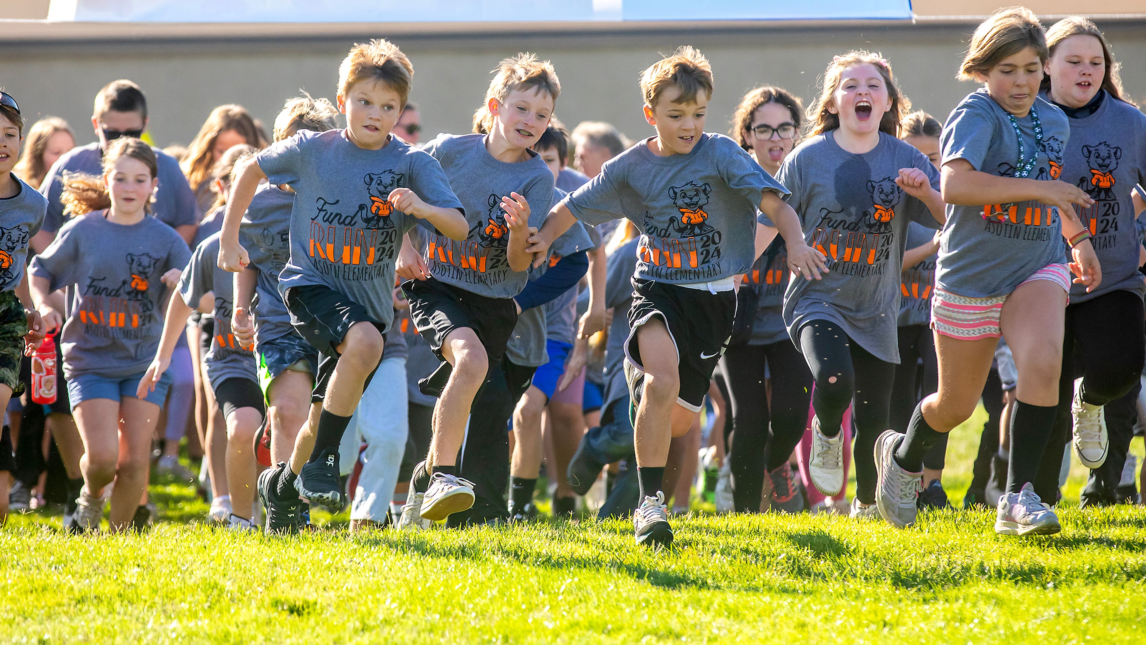 Kids sprint off the line Thursday at the start of Asotin Elementary School�s annual Fund Run at Chief Looking Glass Park. The school had another record breaking year, raising $75,834.