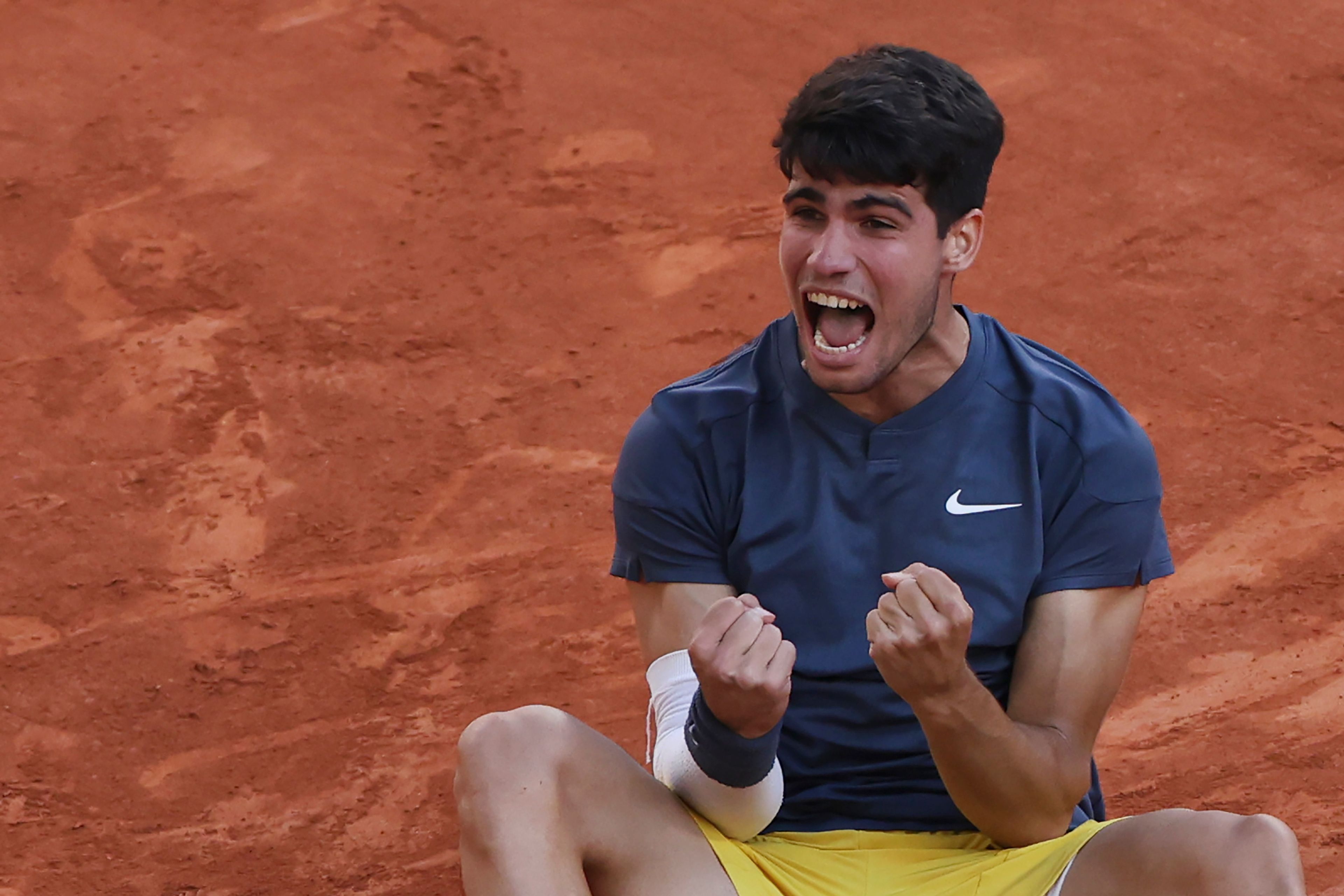 Spain's Carlos Alcaraz celebrates as he won the men's final match of the French Open tennis tournament against Germany's Alexander Zverev at the Roland Garros stadium in Paris, Sunday, June 9, 2024.