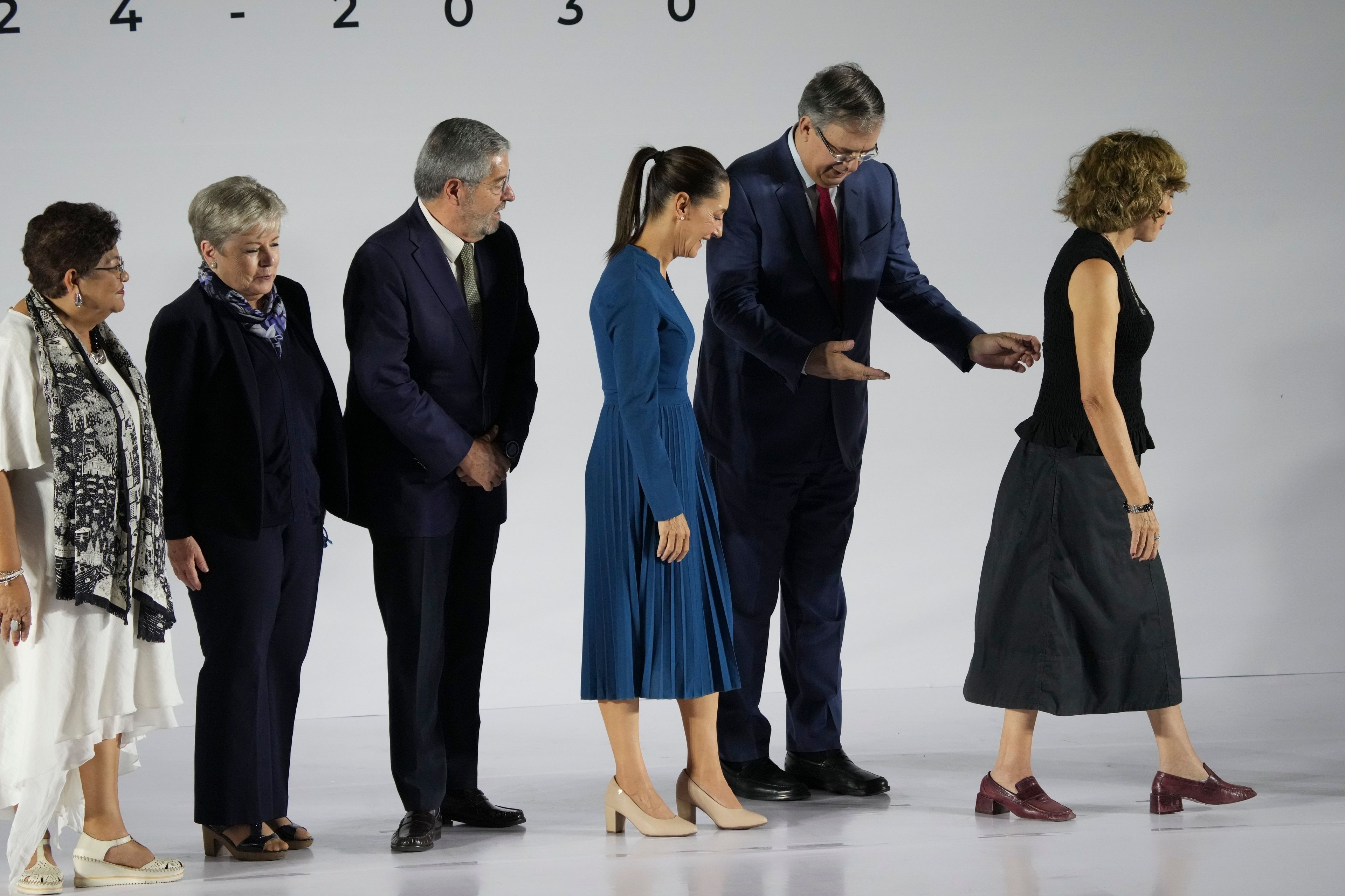 FILE - Ernestina Godoy, legal advisor, from left, Alicia BÃ¡rcena, secretary of environment and natural resources, Juan RamÃ³n de la Fuente, foreign affairs secretary, incoming President Claudia Sheinbaum, Marcelo Ebrard, economy secretary and Rosaura Ruiz, appointed to a new ministry overseeing science, humanities, technology and innovation, leave a press conference where Sheinbaum presented six members of her Cabinet, in Mexico City, June 20, 2024. (AP Photo/Marco Ugarte, File)