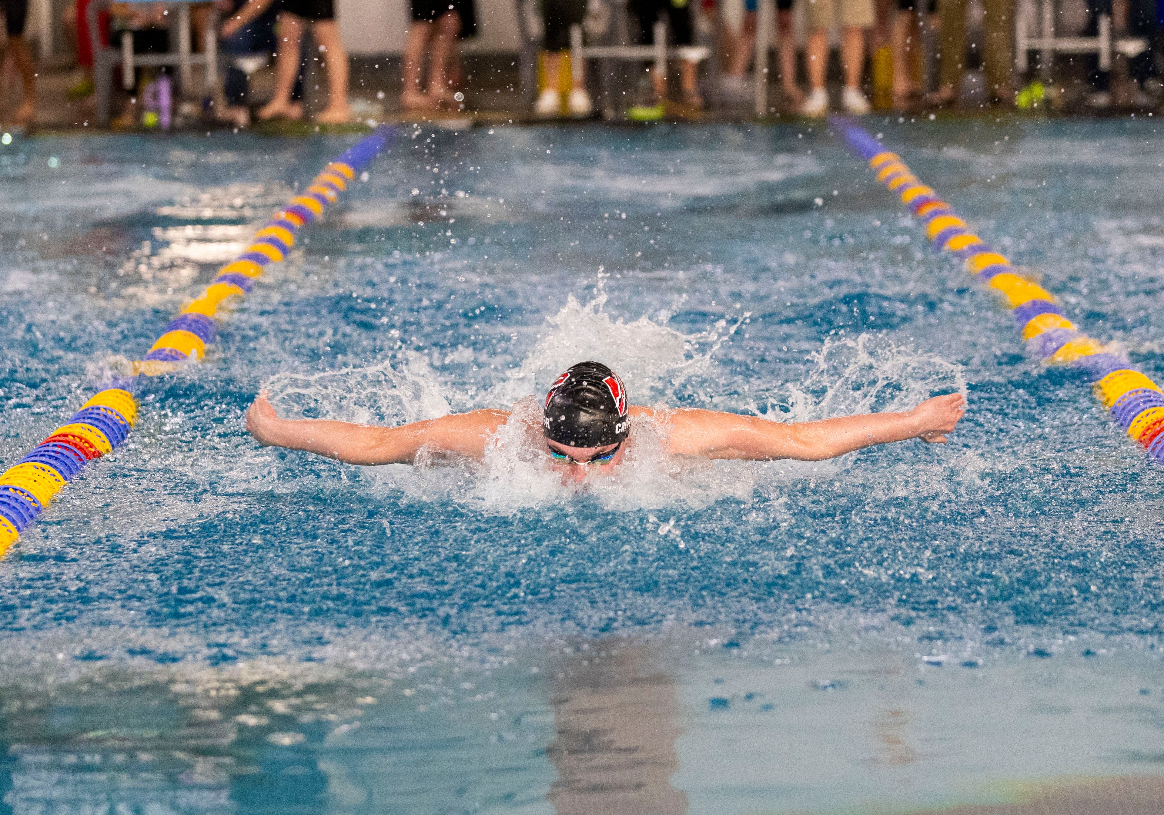 Moscow’s Noah Crossler swims the 100-yard butterfly during the Idaho Class 5A state swim meet Saturday at Boise’s West Ada YMCA. Crossler broke a state record in the race.