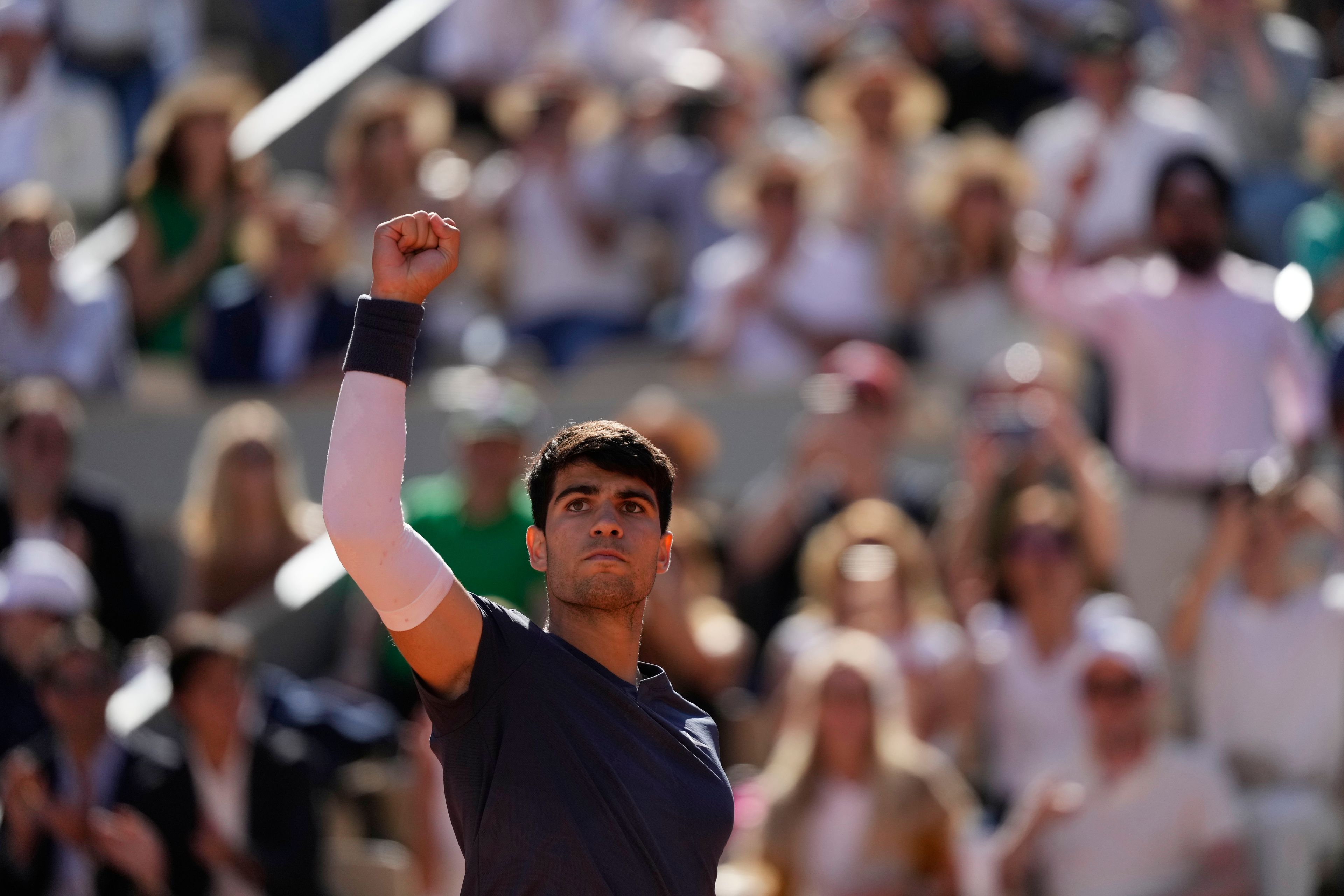 Spain's Carlos Alcaraz reacts during his semifinal match of the French Open tennis tournament against Italy's Jannik Sinner at the Roland Garros stadium in Paris, Friday, June 7, 2024.