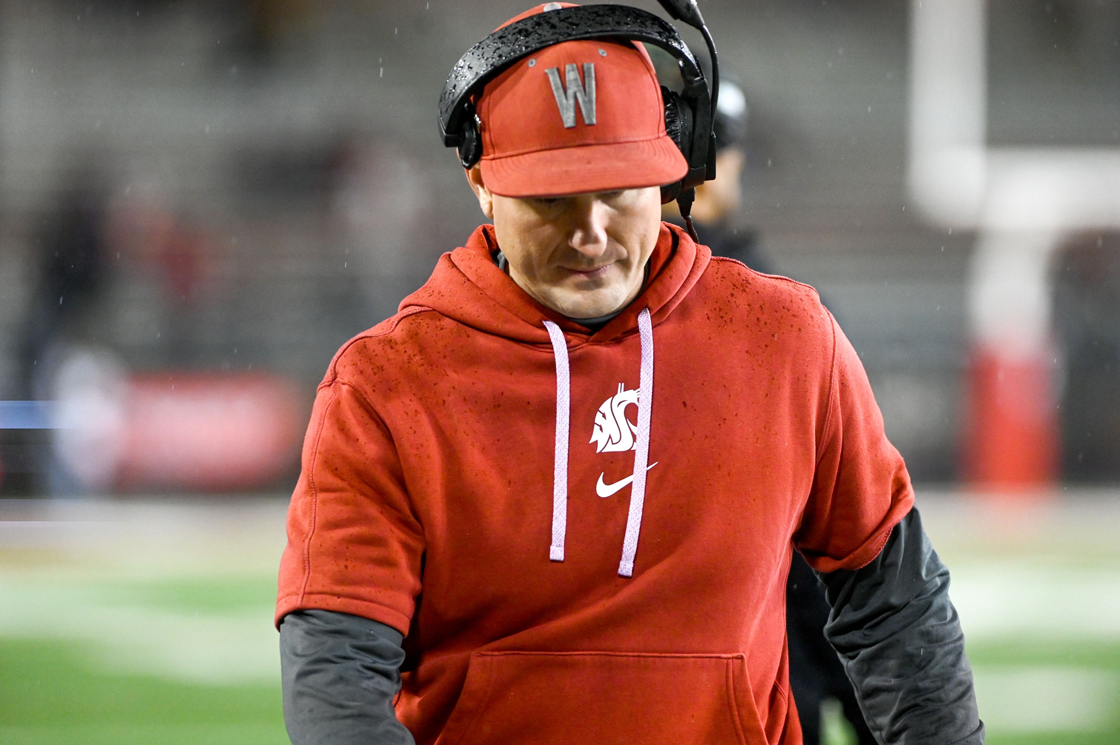 Washington State head coach Jake Dickert looks down during a game against Utah State on Nov. 9 at Gesa Field in Pullman.