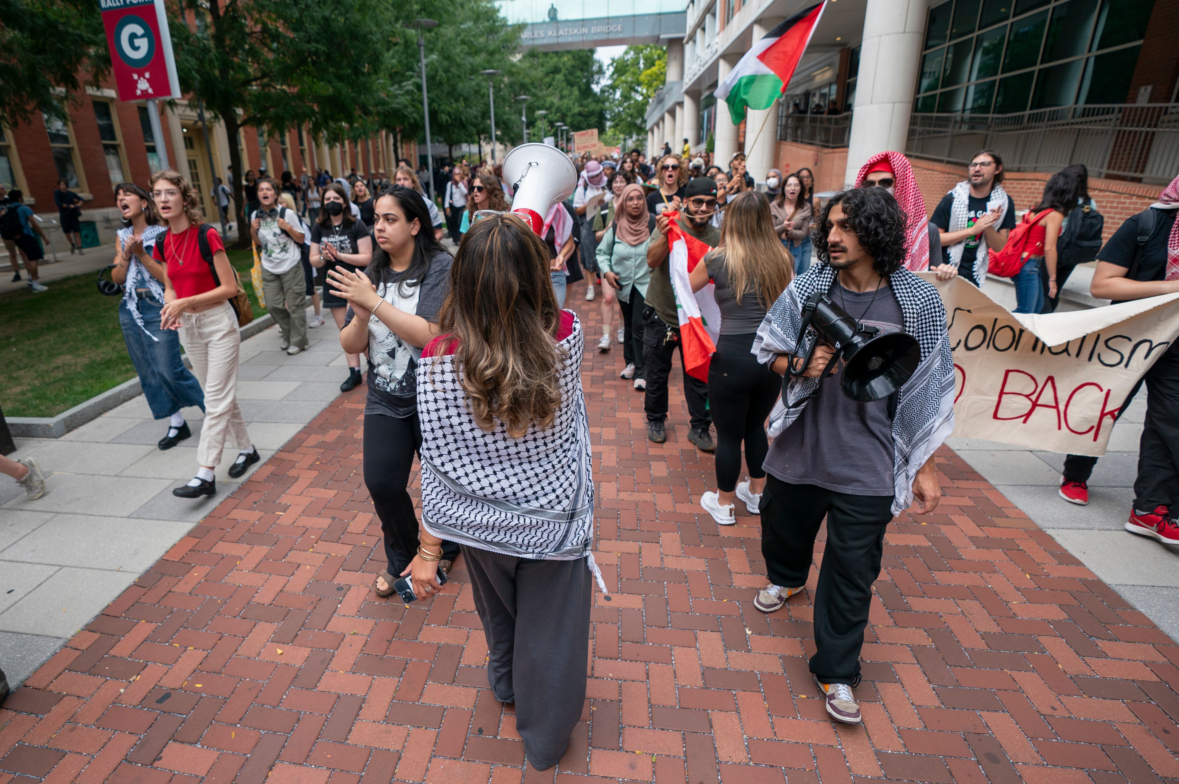 Alia Amanpour Trapp, center, leads the crowd during a pro-Palestine rally and march on Temple University campus in Philadelphia, Aug. 29, 2024.