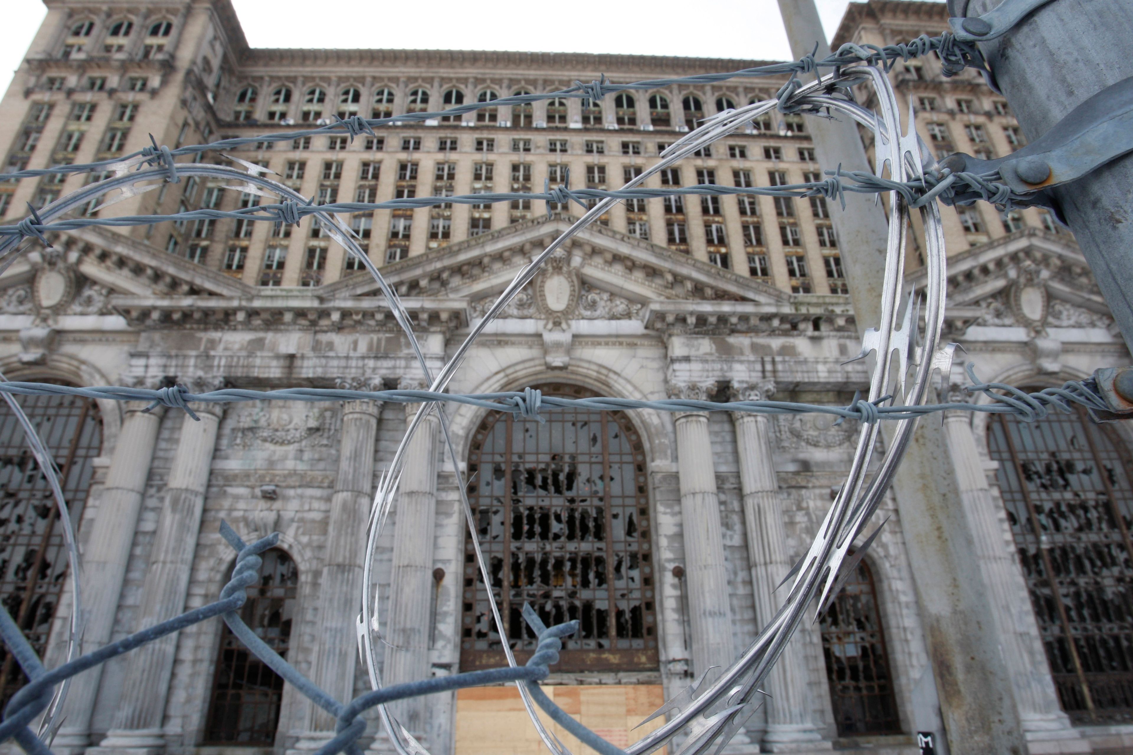 FILE- The abandoned Michigan Central Station is seen, Thursday, Jan. 21, 2010 in Detroit. A once hulking scavenger-ravaged monolith that symbolized Detroit's decline reopens this week after a massive six-year multimillion dollar renovation by Ford Motor Co., which restored the Michigan Central Station to its past grandeur with a focus squarely on the future of mobility.