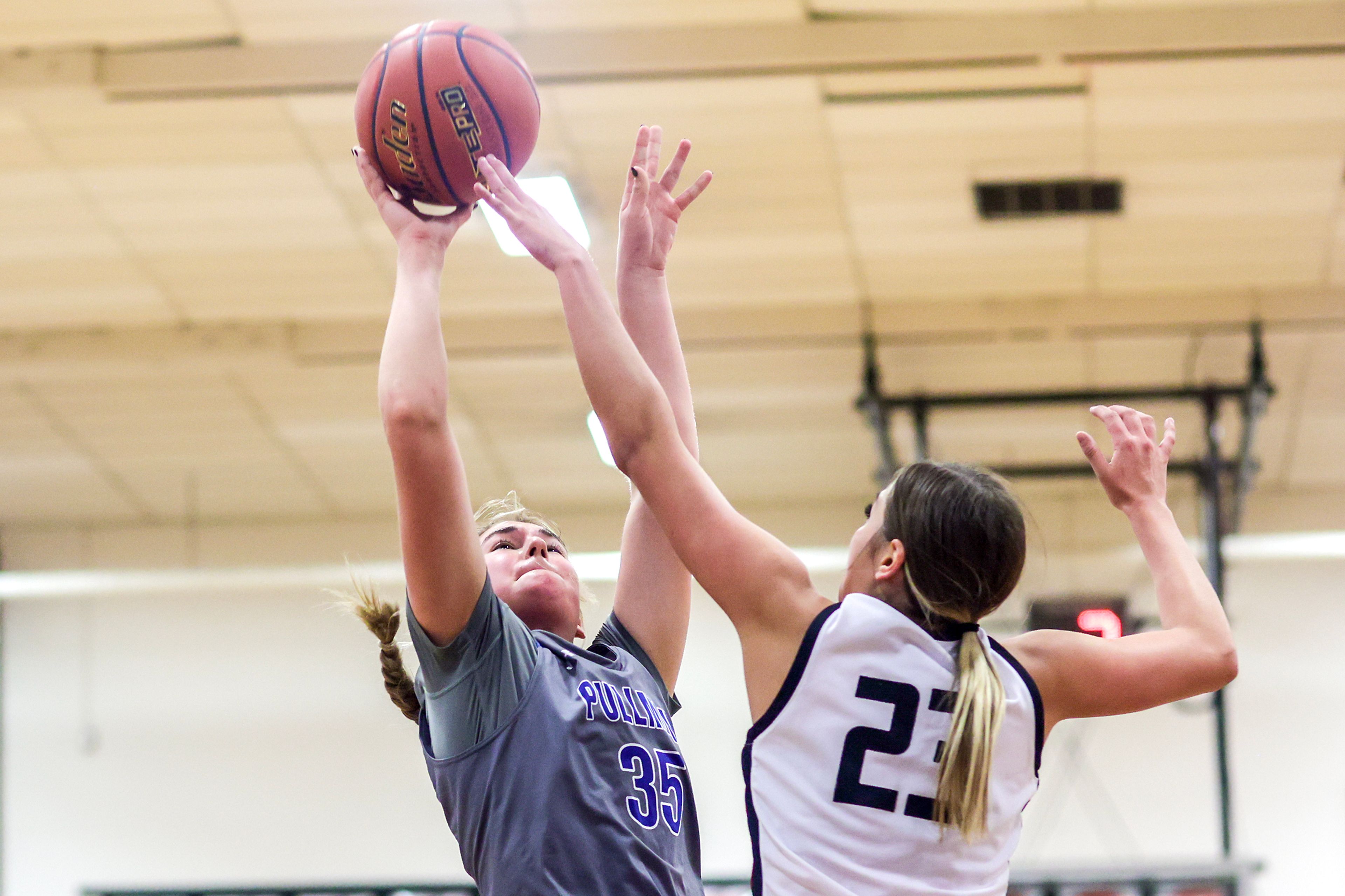 Pullman post Ryliann Bednar, left, shoots the ball as Clarkston wing Alahondra Perez defends during Tuesday's Class 2A Greater Spokane League girls basketball game.