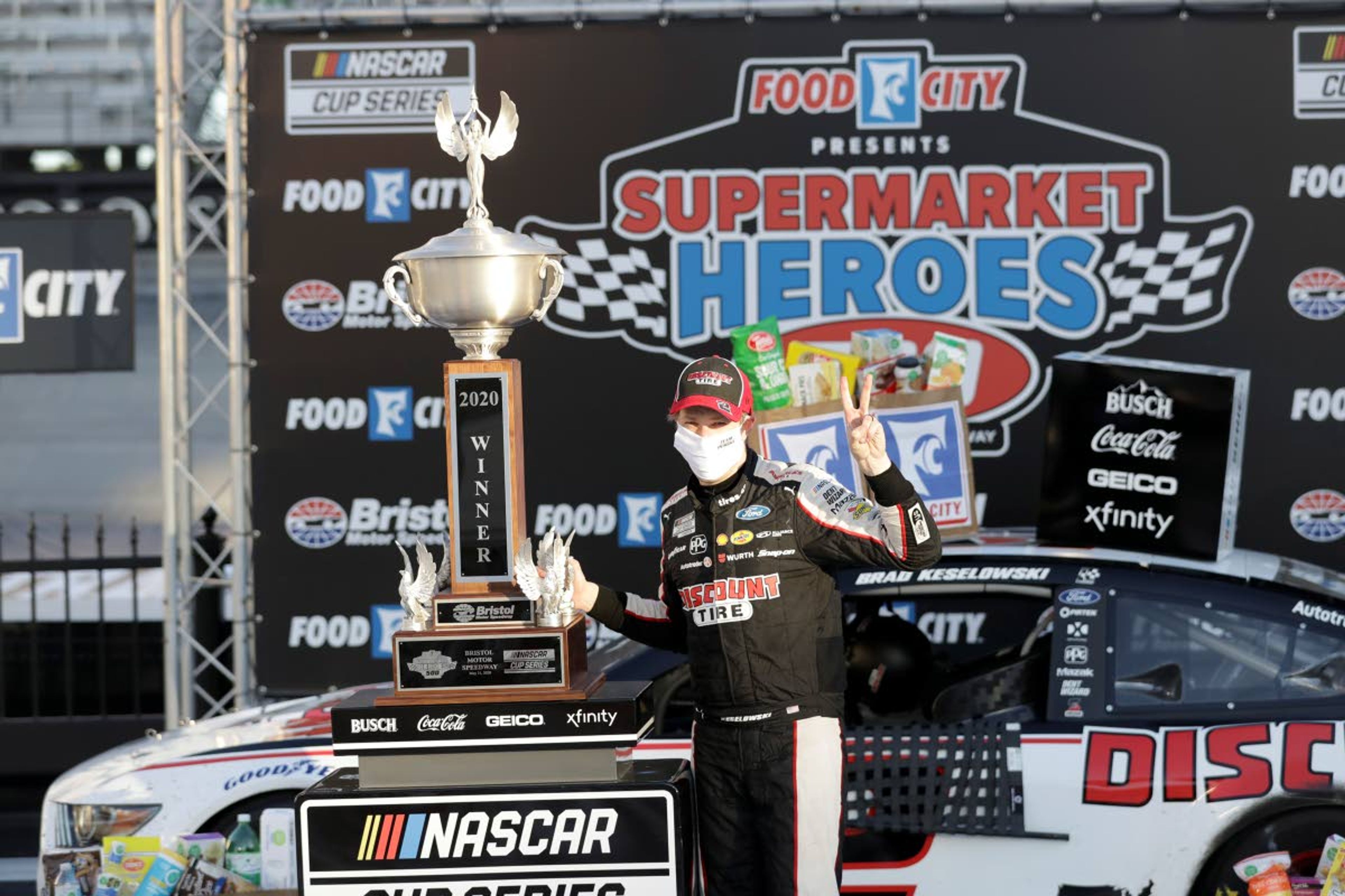 A masked Brad Keselowski celebrates a second straight victory.