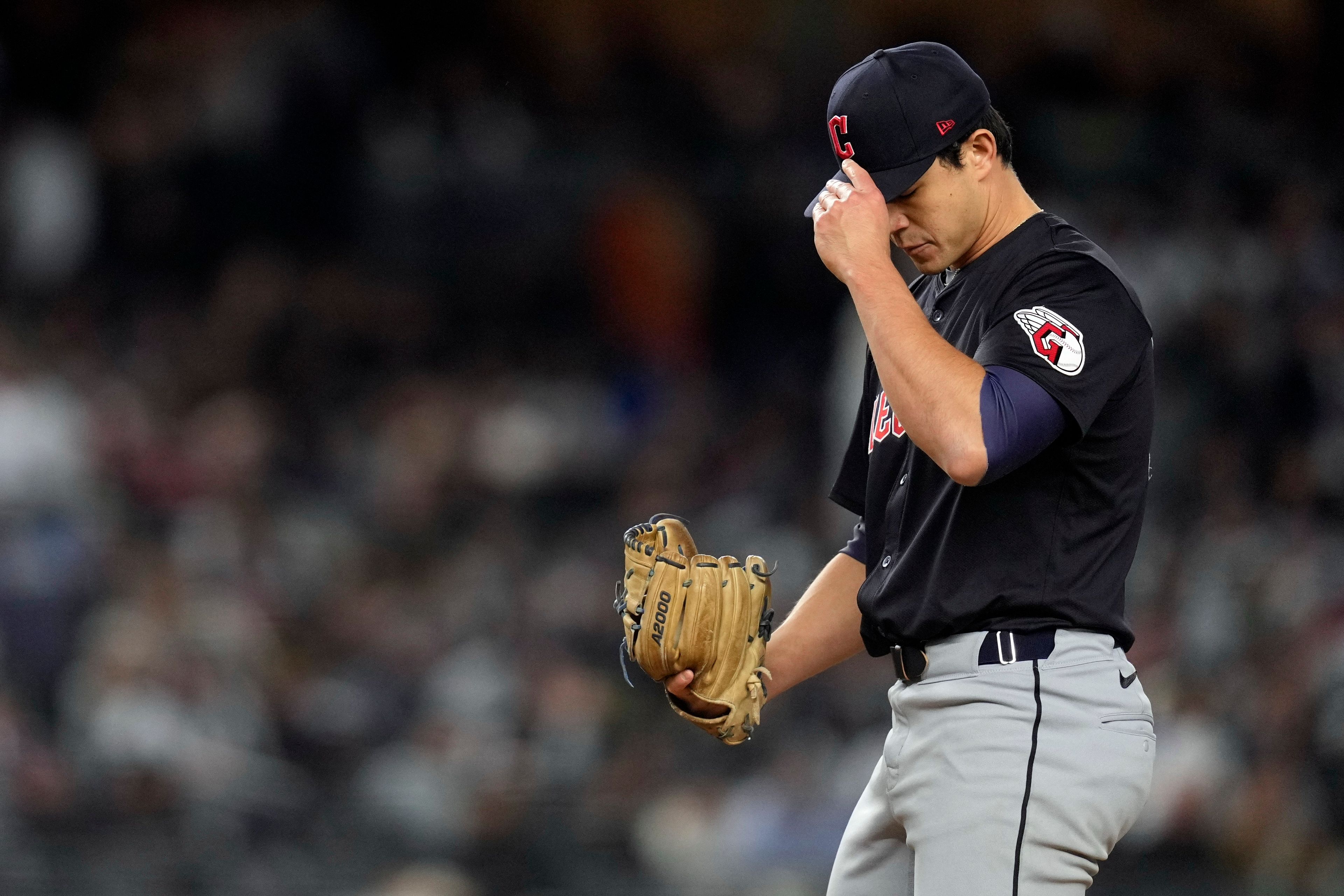 Cleveland Guardians relief pitcher Joey Cantillo adjusts his cap after walking New York Yankees' Gleyber Torres during the fourth inning in Game 1 of the baseball AL Championship Series Monday, Oct. 14, 2024, in New York. (AP Photo/Godofredo VÃ¡squez)