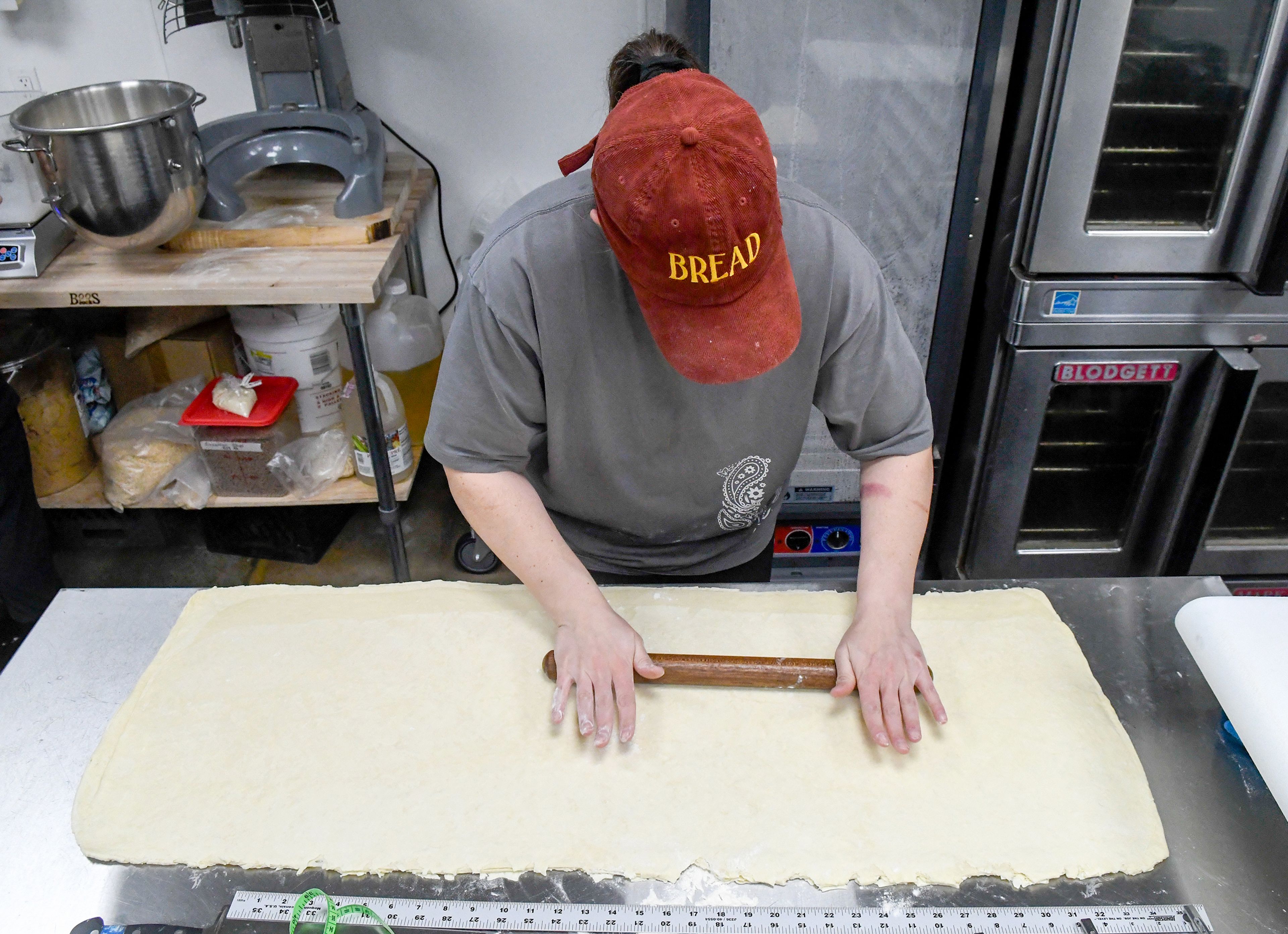 Regina Konigsberg, an owner and pastry chef at Knead Cafe & Patisserie, prepares croissants. 