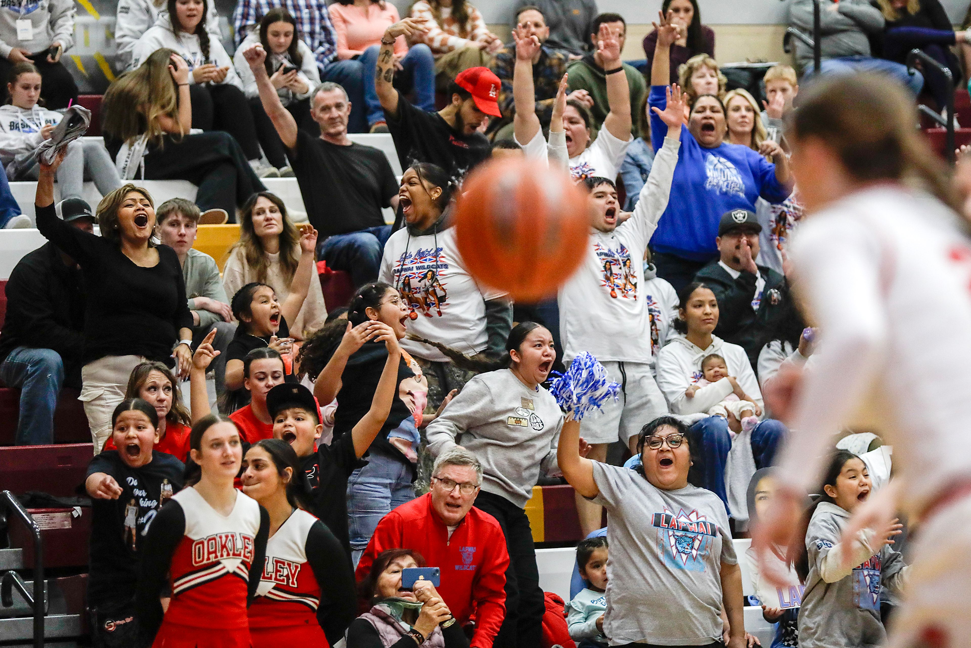 Lapwai fans cheer after a 3-pointer against Oakley during an Idaho Class 1A DI girls state semifinal game Friday at Columbia High School.