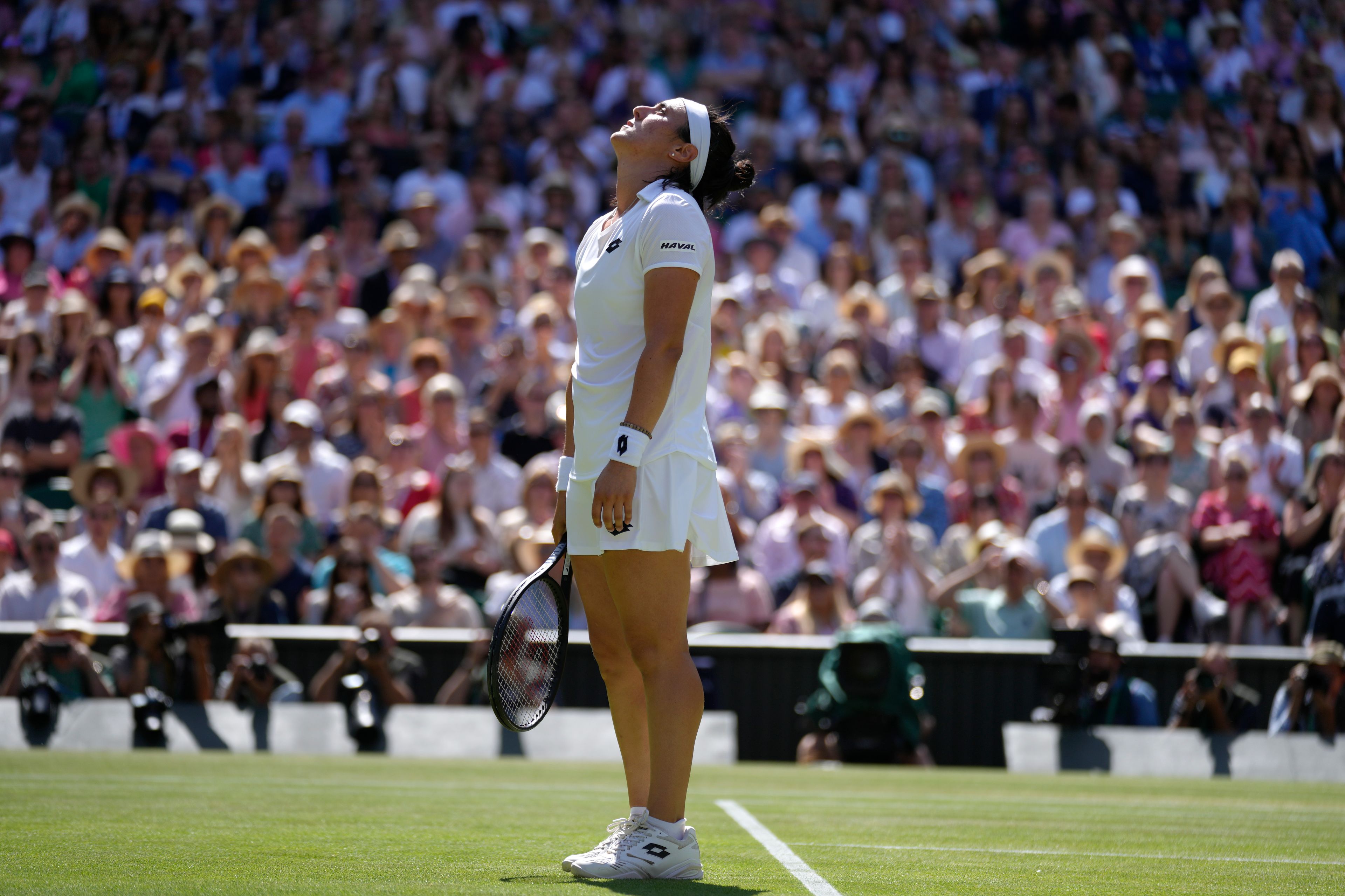 Tunisia's Ons Jabeur reacts after losing a point to Kazakhstan's Elena Rybakina in the final of the women's singles on day thirteen of the Wimbledon tennis championships in London, Saturday, July 9, 2022. (AP Photo/Kirsty Wigglesworth)