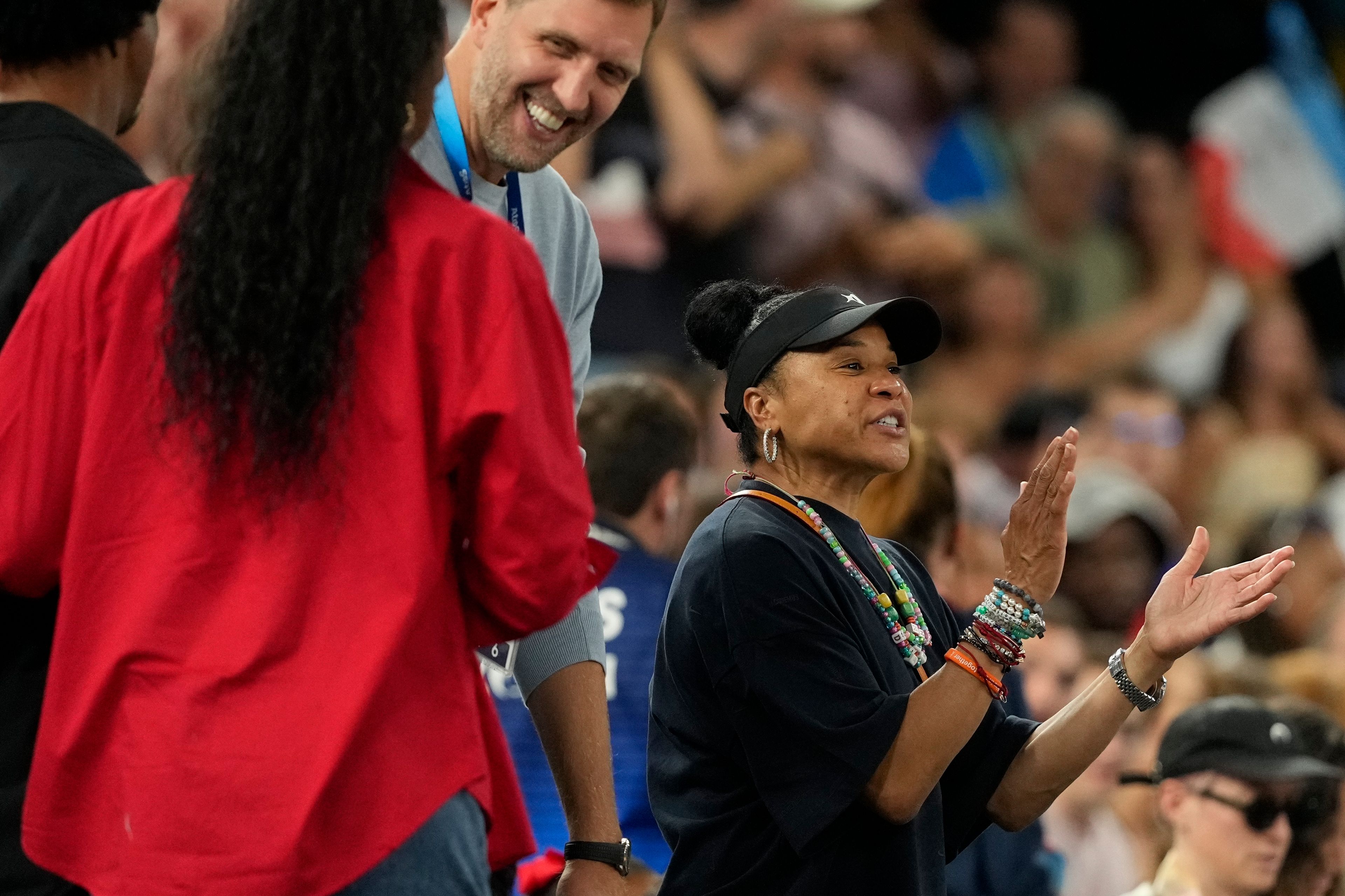 Dawn Staley claps during a women's gold medal basketball game at Bercy Arena at the 2024 Summer Olympics, Sunday, Aug. 11, 2024, in Paris, France.