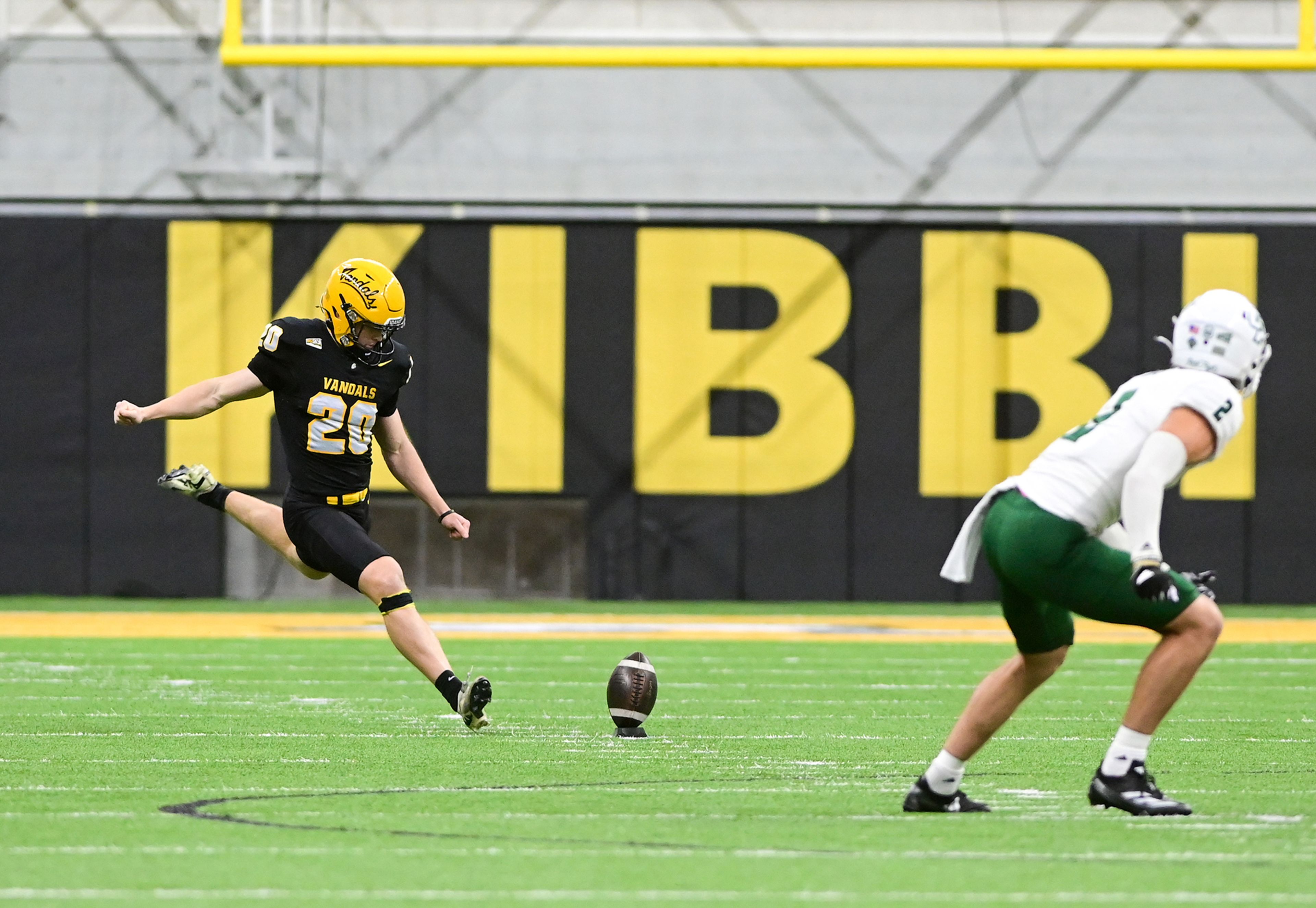 Idaho place kicker Owen Forsman starts a game against Cal Poly with a kick into the end zone Saturday at the P1FCU Kibbie Dome in Moscow.,