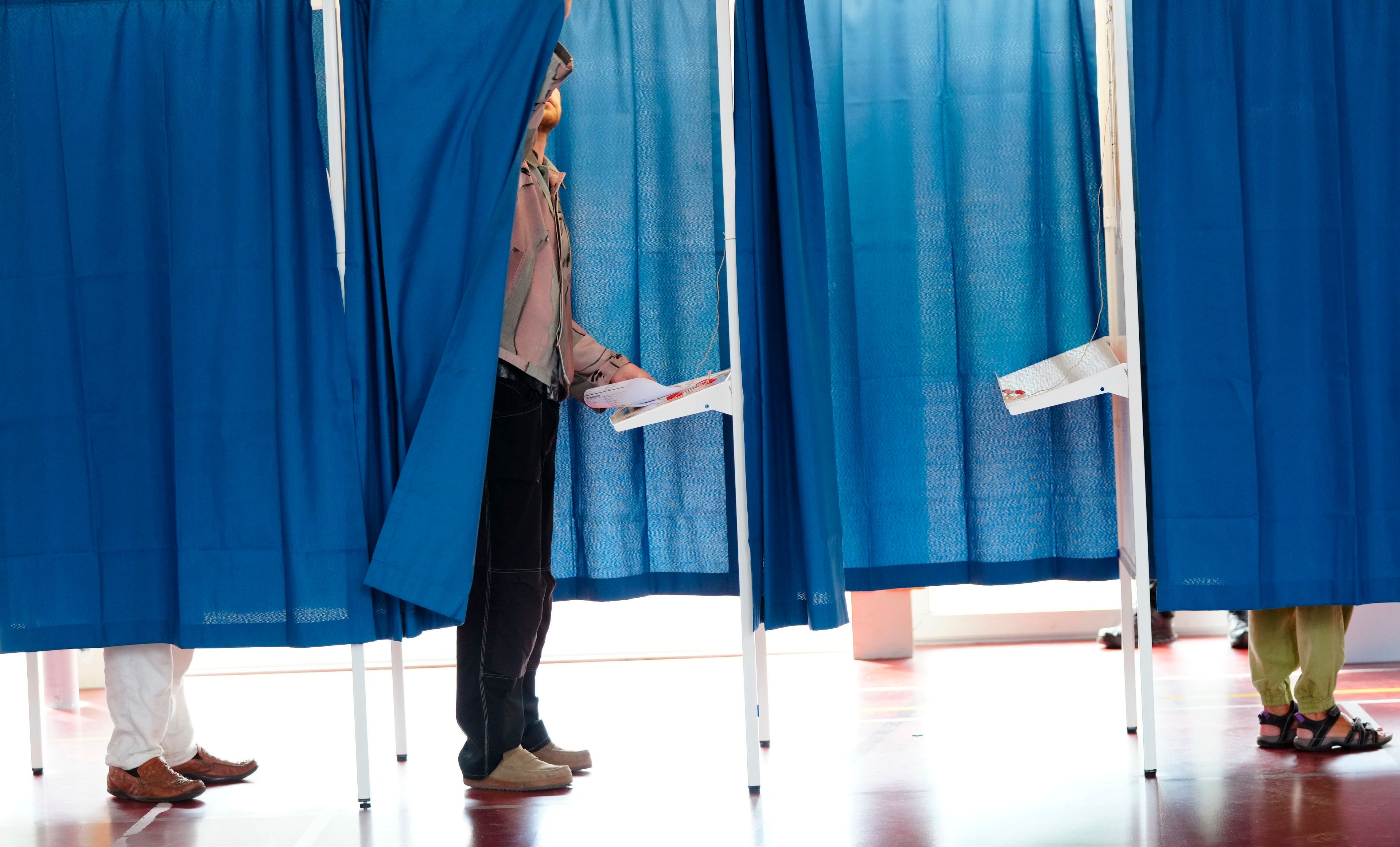 People cast their votes for the European Parliament election, at Nyboder School, in Copenhagen, Denmark, Sunday, June 9, 2024. Polling stations have opened across Europe as voters from 20 countries cast ballots in elections that are expected to shift the European Union’s parliament to the right and could reshape the future direction of the world’s biggest trading bloc.