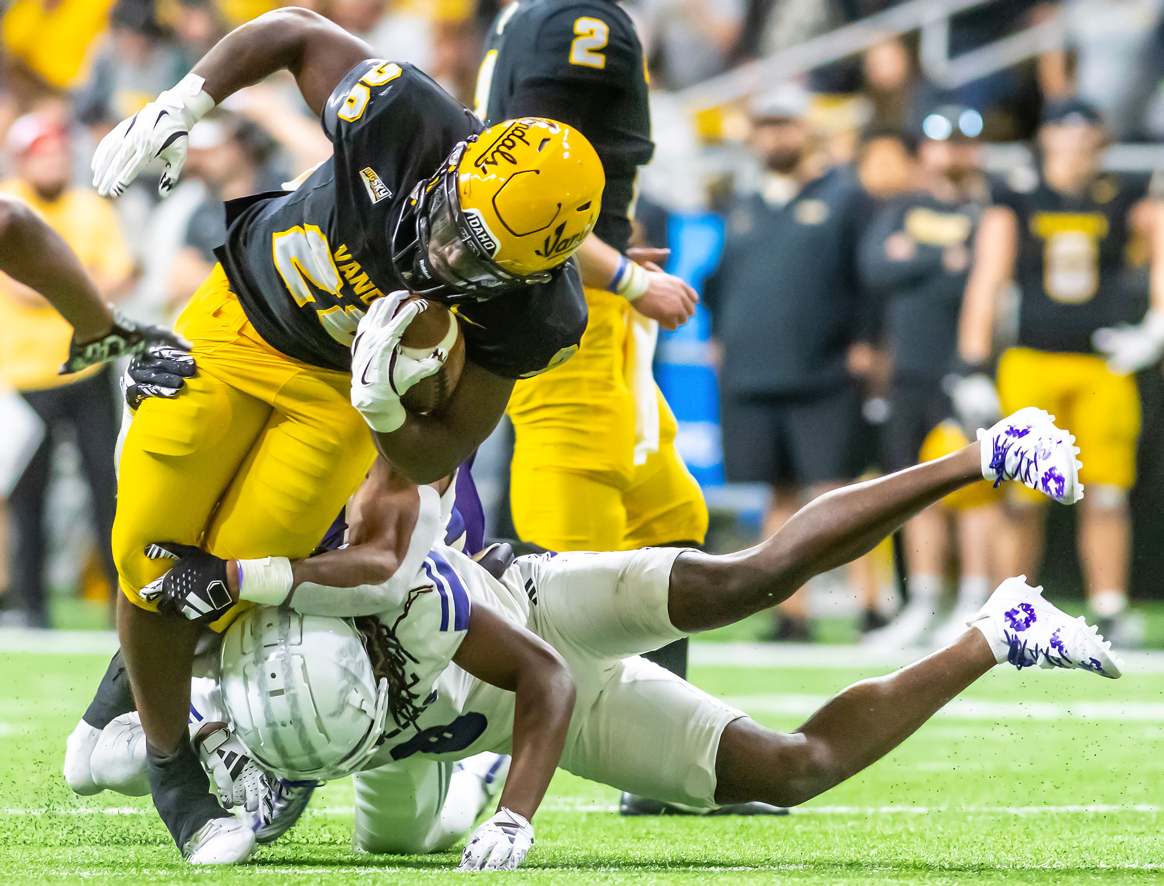 Idaho running back Nate Thomas is tackled by Weber State during a quarter of a Big Sky conference game Saturday at the P1FCU Kibbie Dome in Moscow.