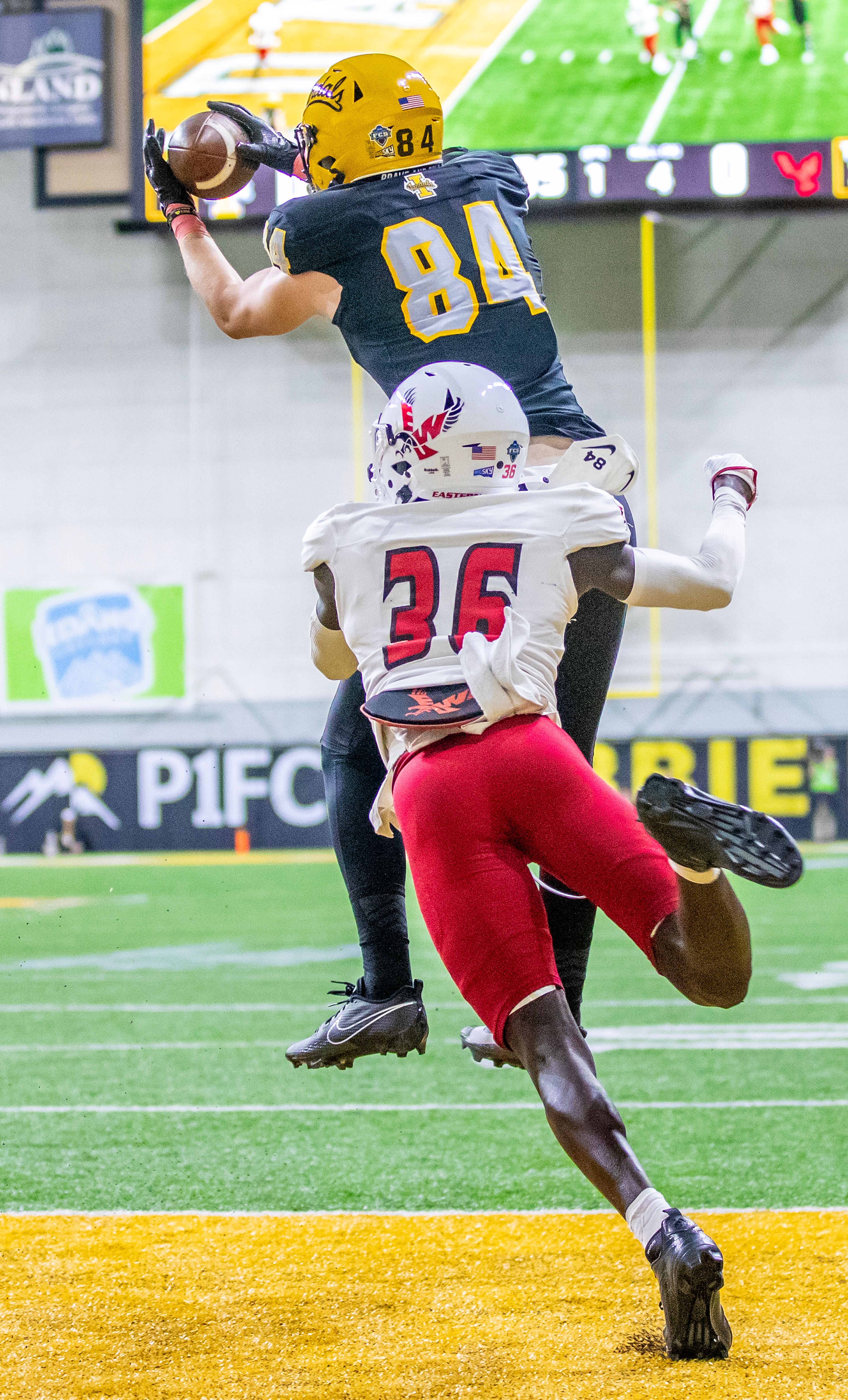 Idaho tight end Alex Moore brings down a pass for a touchdown as Eastern Washington cornerback Alphonse Oywak tries to break it up during a Big Sky game Saturday at the Kibbie Dome in Moscow. ,