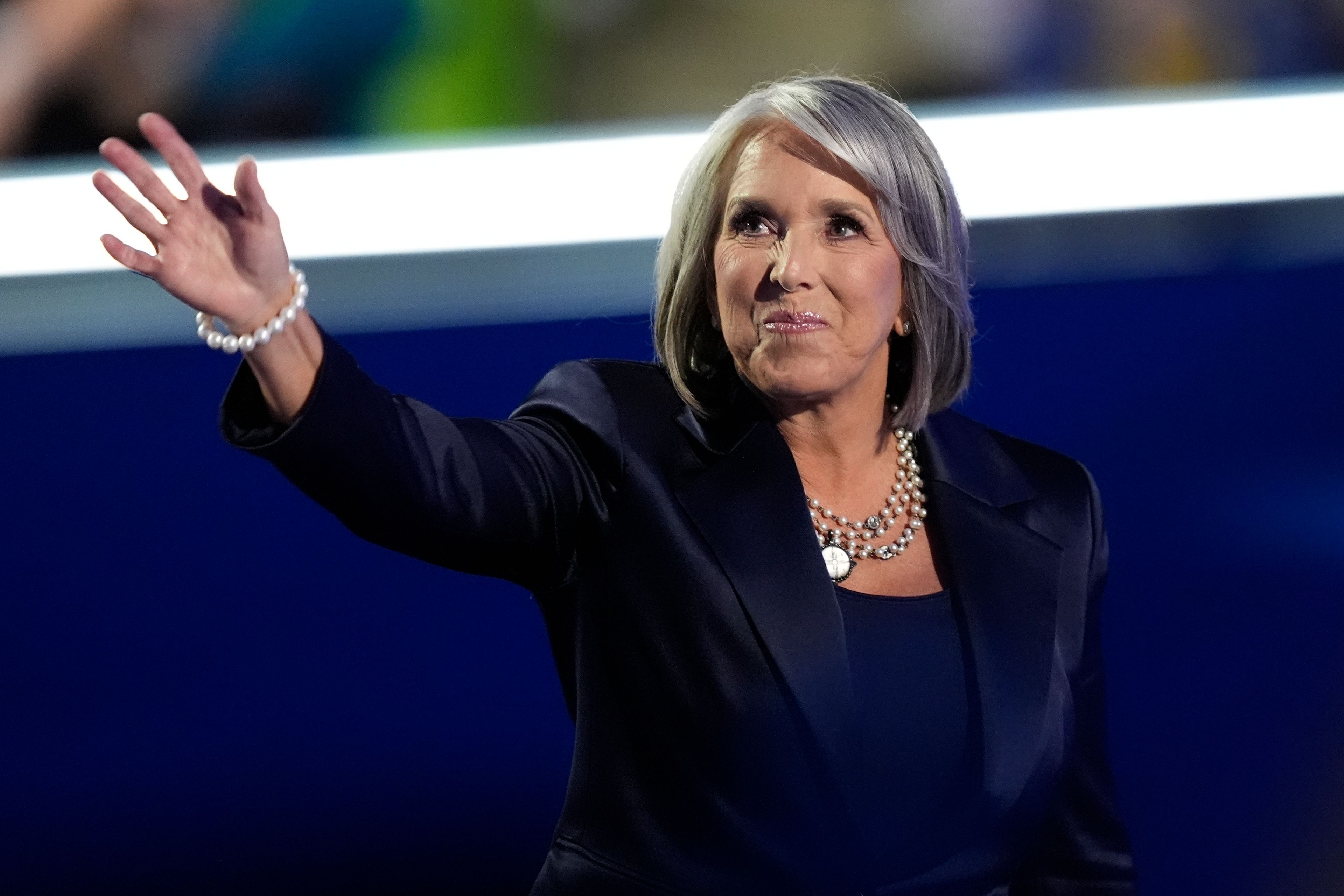 New Mexico Gov. Michelle Lujan Grisham waves during the Democratic National Convention Tuesday, Aug. 20, 2024, in Chicago.