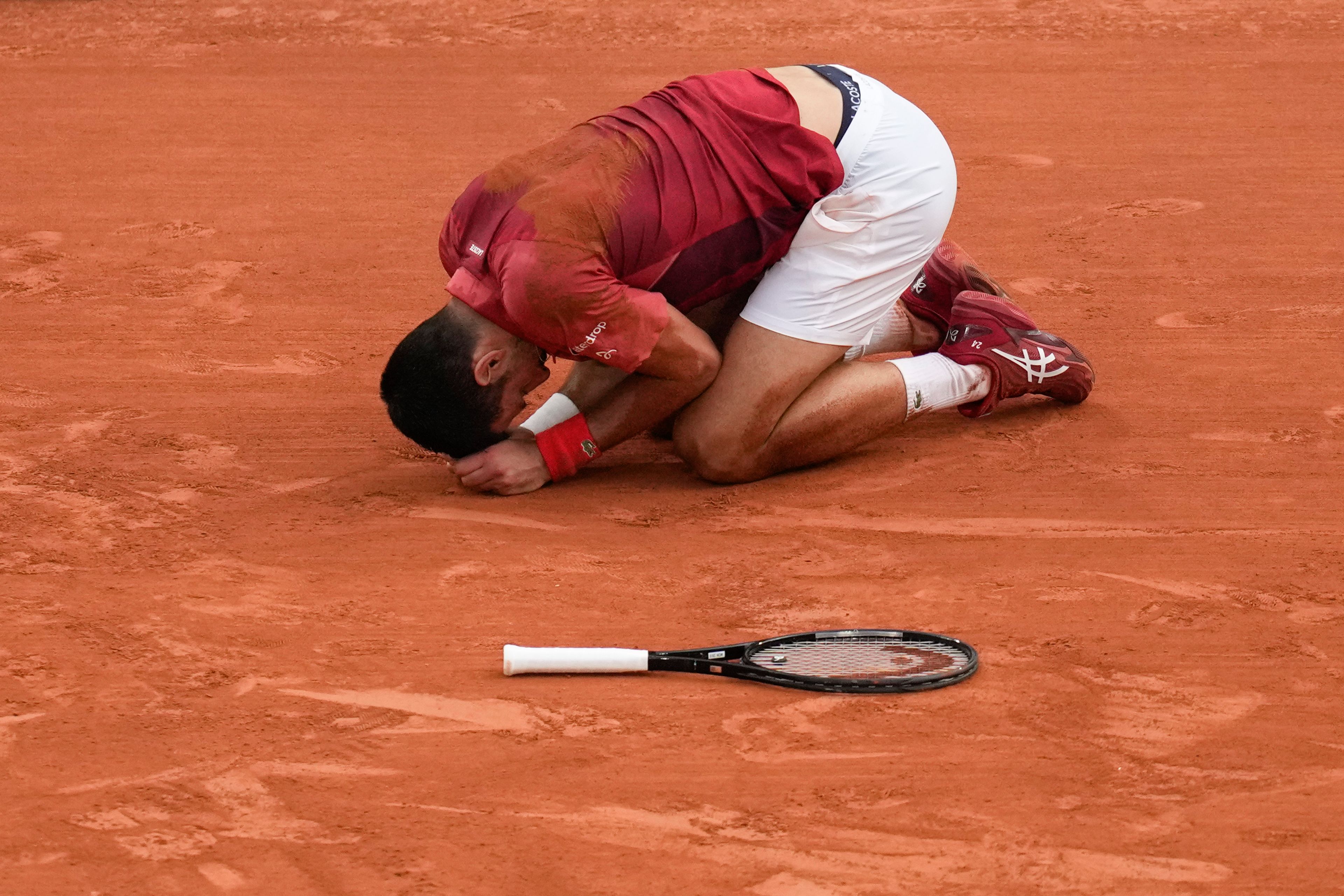 Serbia's Novak Djokovic slipped and fell during his fourth round match of the French Open tennis tournament against Argentina's Francisco Cerundolo at the Roland Garros stadium in Paris, Monday, June 3, 2024.