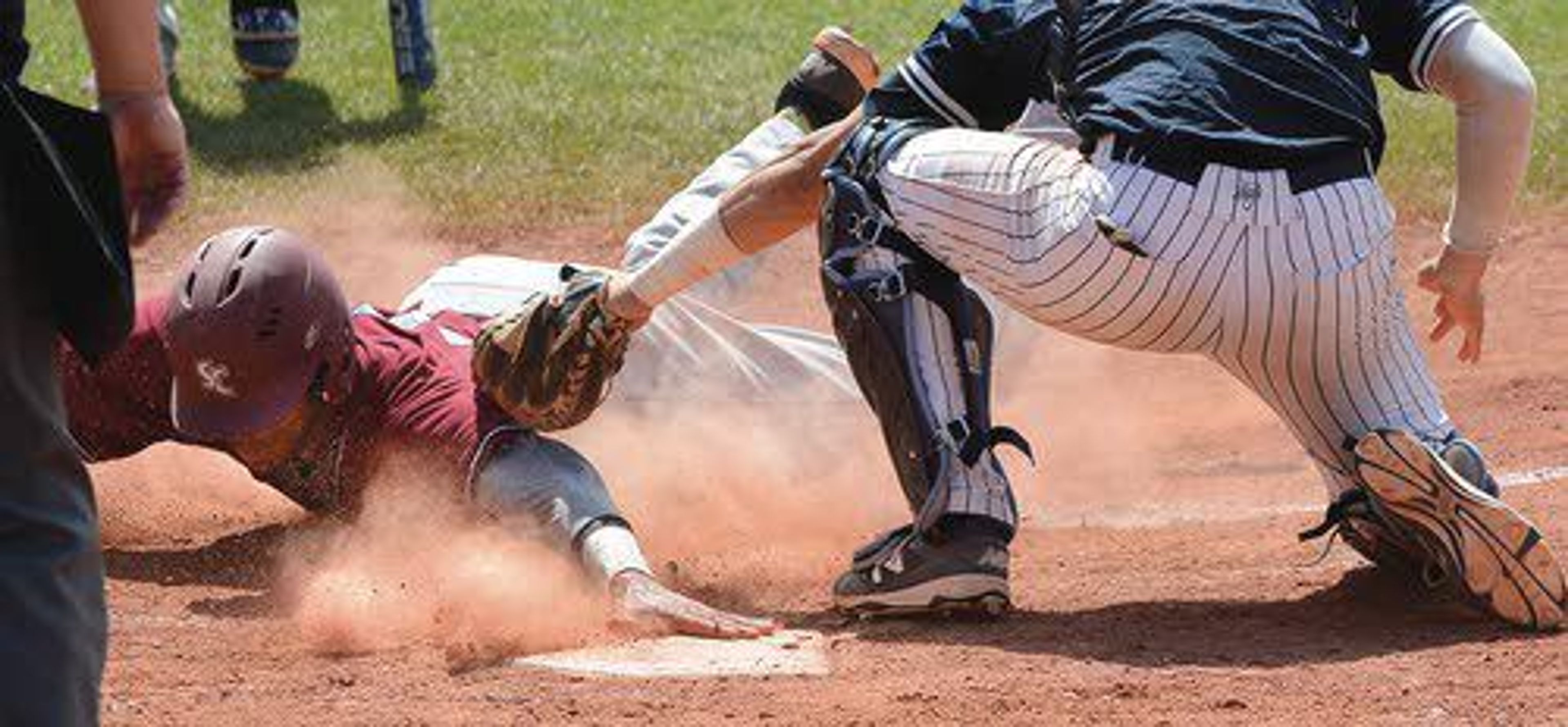 In a daring steal of home, Sterling’s Aaron Stubblefield slides in safely ahead of The Masters’ tag from David Sheaffer in the seventh inning.