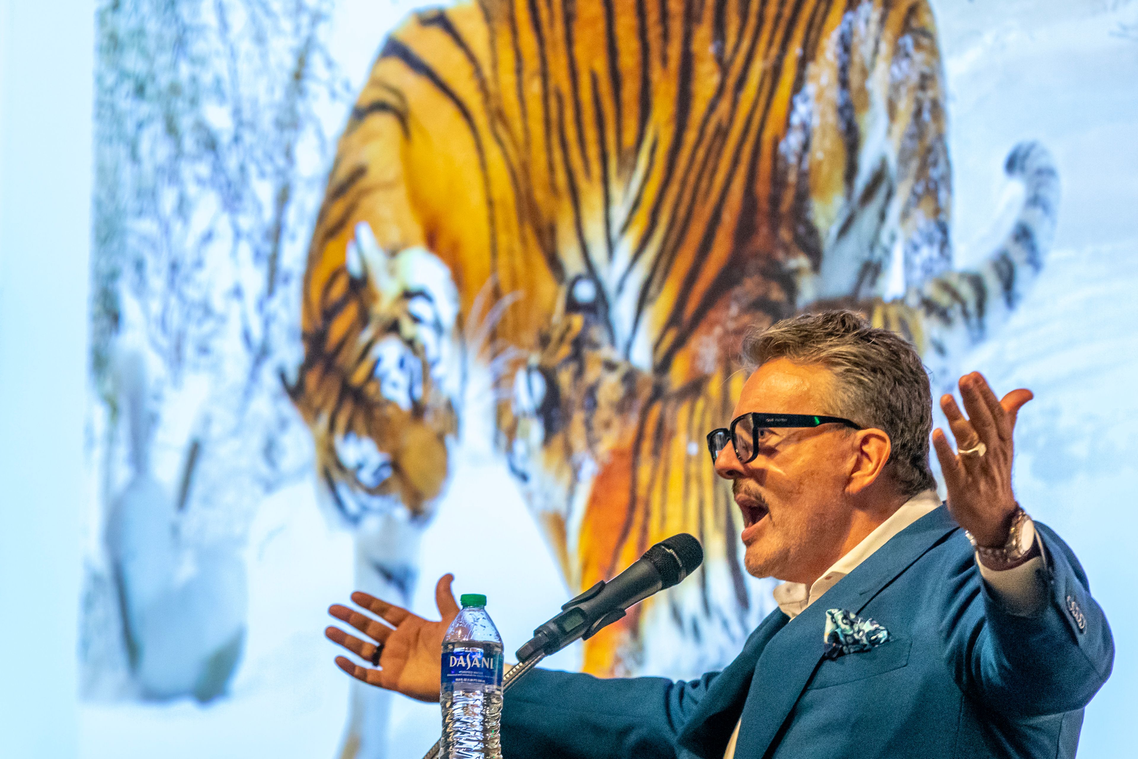 Donor Dwayne Clark greets the crowd before his speech Thursday before the unveiling of the Bengal Monument at Lewiston High School.