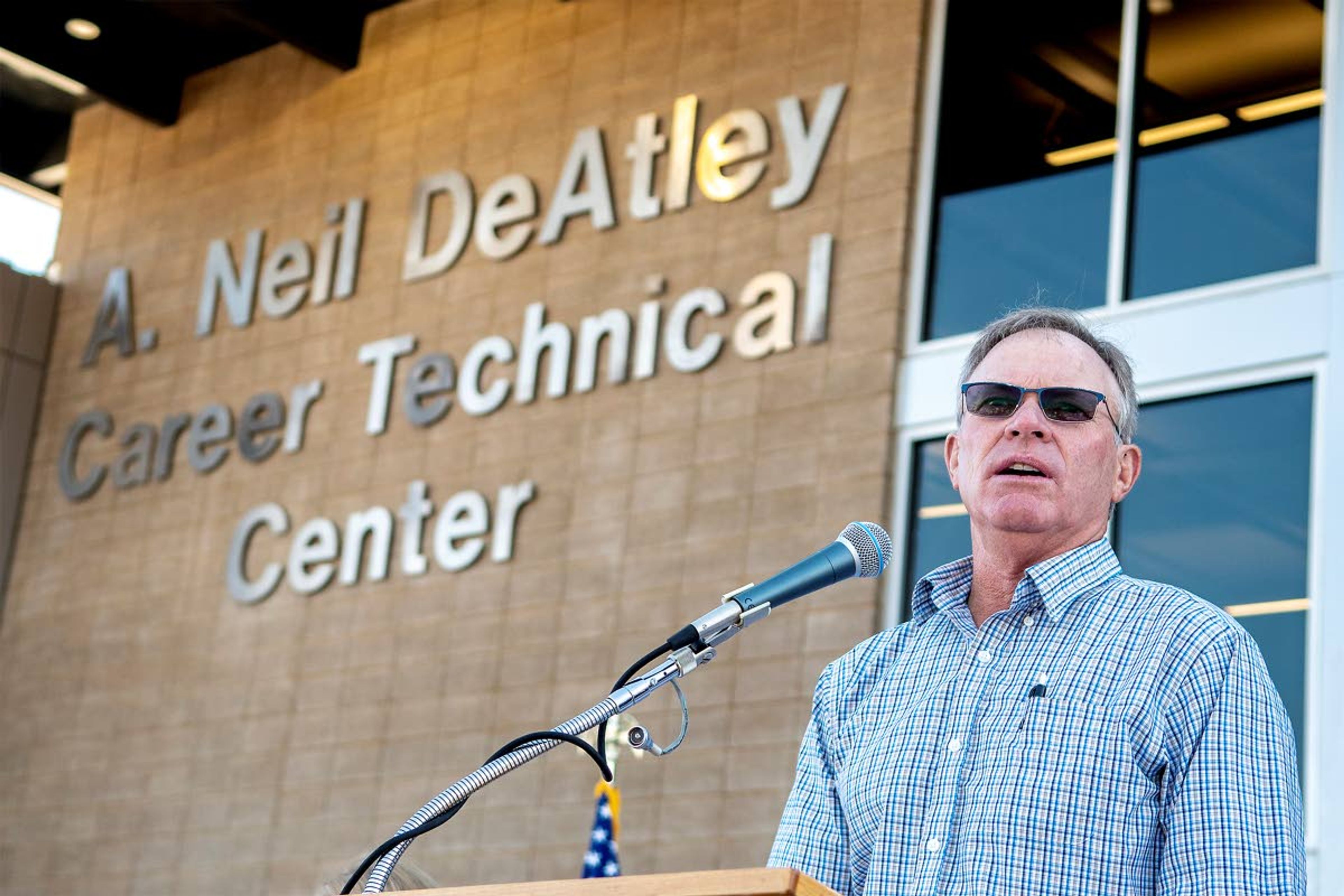 Brien DeAtley speaks in front of the new A. Neil DeAtley Career Technical Center, named for his father, prior to Friday's ribbon-cutting ceremony.