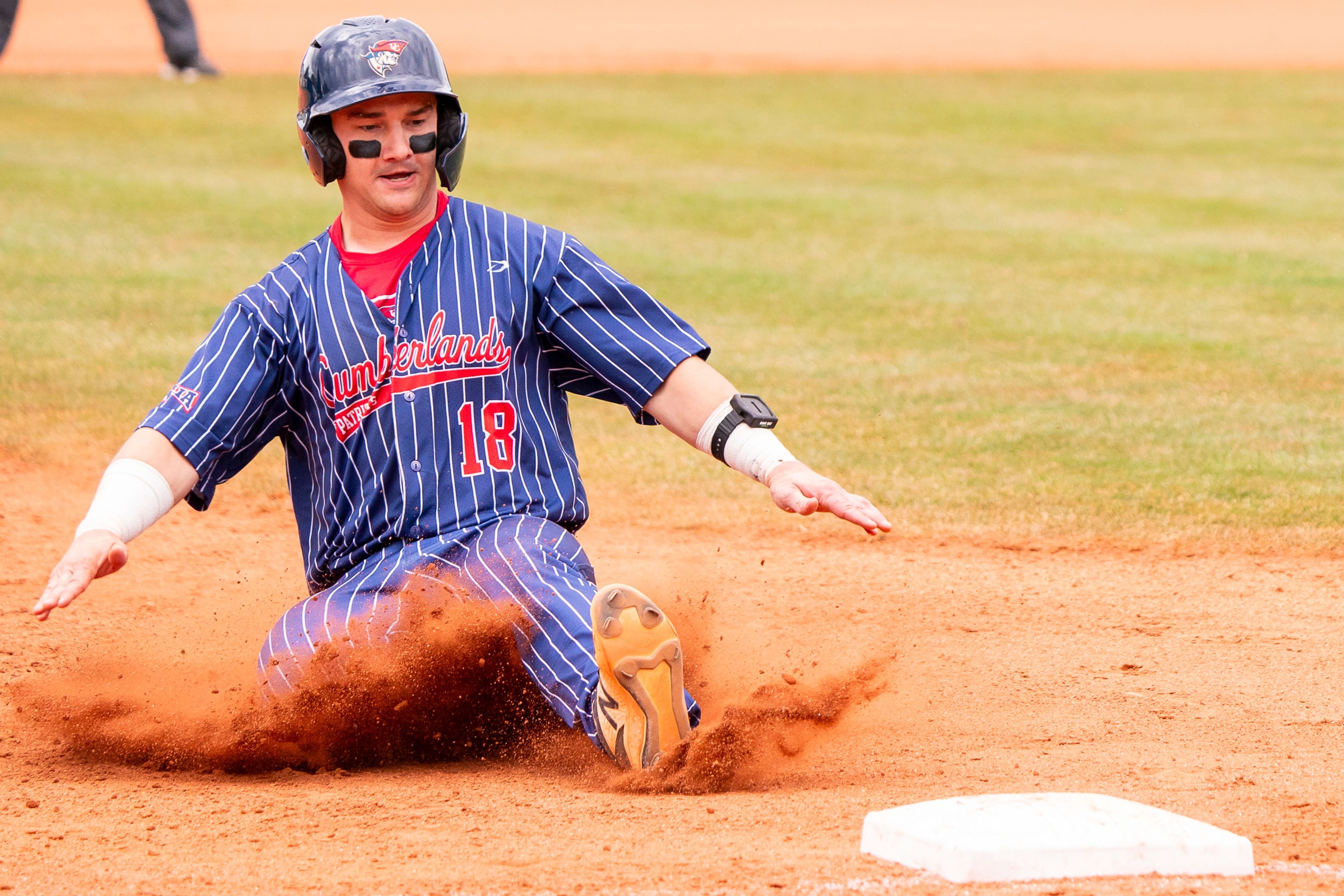 Cumberlands’ Ben Snapp slides into third base during game 6 of the NAIA World Series against William Carey on Saturday at Harris Field in Lewiston.