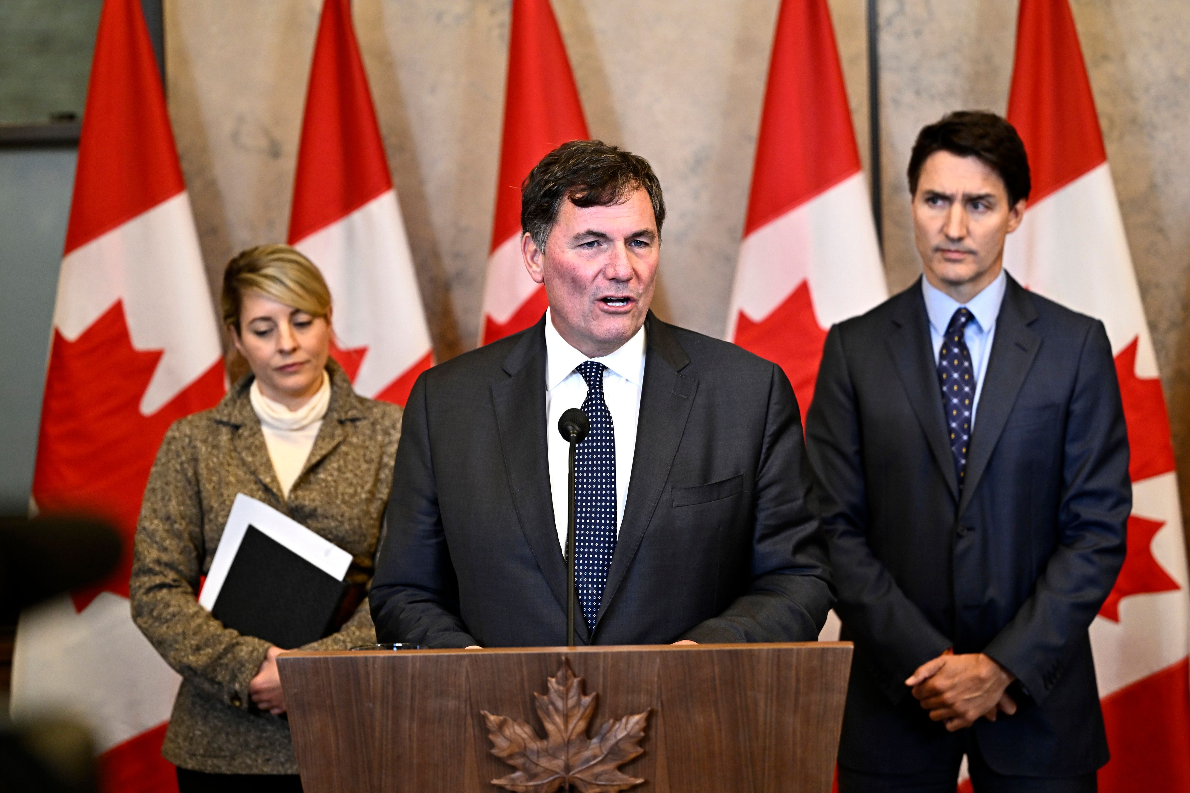 Minister of Public Safety, Democratic Institutions and Intergovernmental Affairs Dominic LeBlanc, centre, Prime Minister Justin Trudeau, right, and Minister of Foreign Affairs Melanie Joly participate in a news conference on the investigative efforts related to violent criminal activity occurring in Canada with connections to India, on Parliament Hill in Ottawa, on Monday, Oct. 14, 2024. (Justin Tang/The Canadian Press via AP)