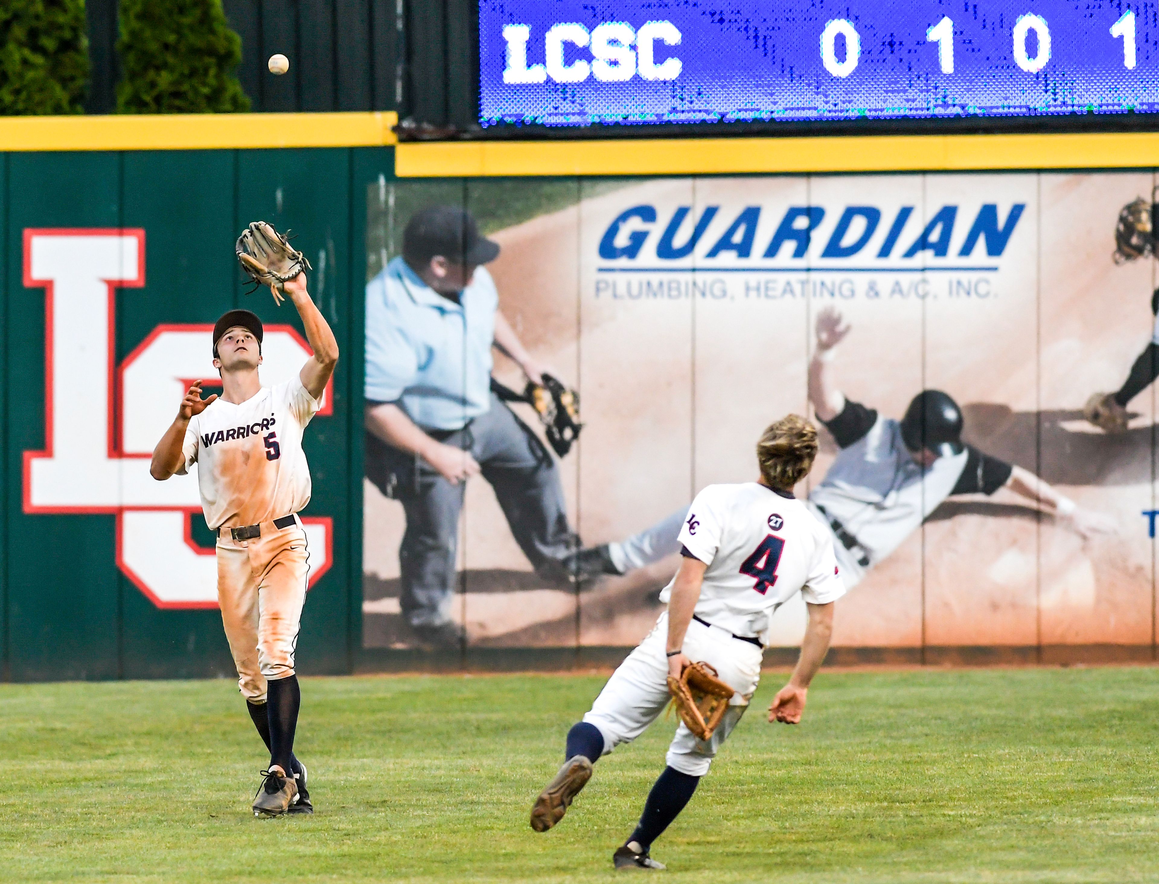 Lewis-Clark State right fielder Brandon Cabrera makes a catch against UBC in an inning of a first round game of the NAIA Opening Round Monday at Harris Field in Lewiston.