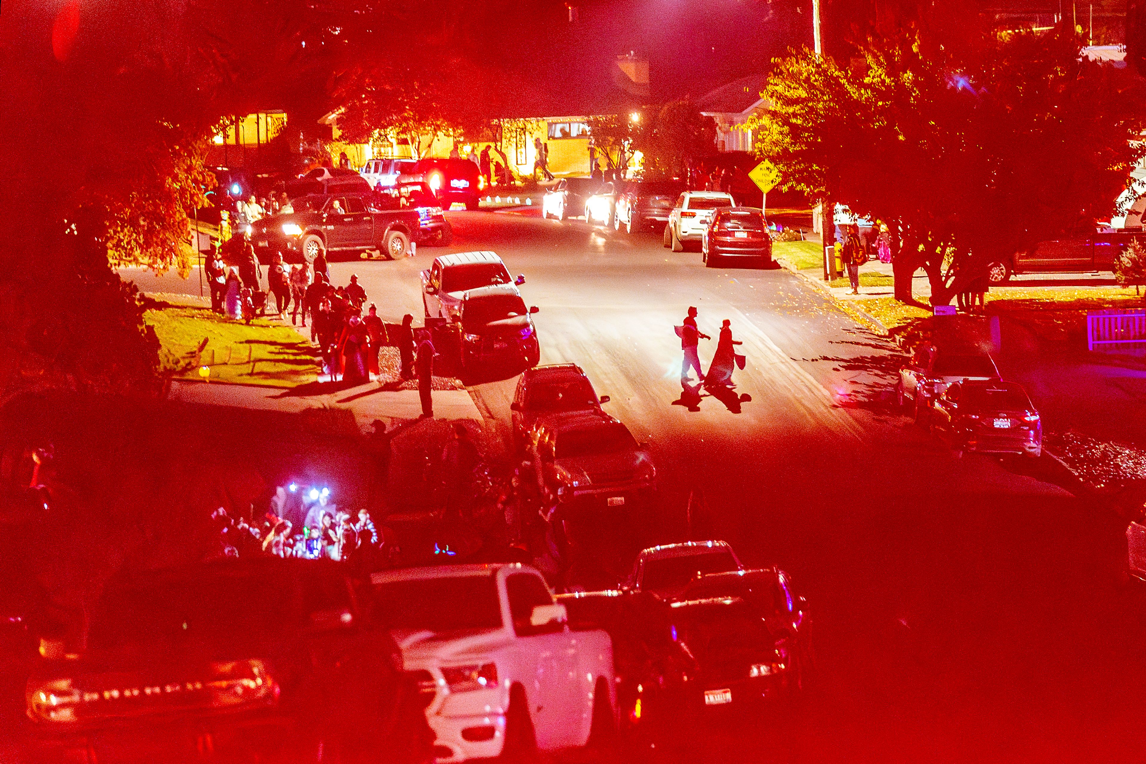 People move through the Sunset Drive neighborhood Thursday in Lewiston.