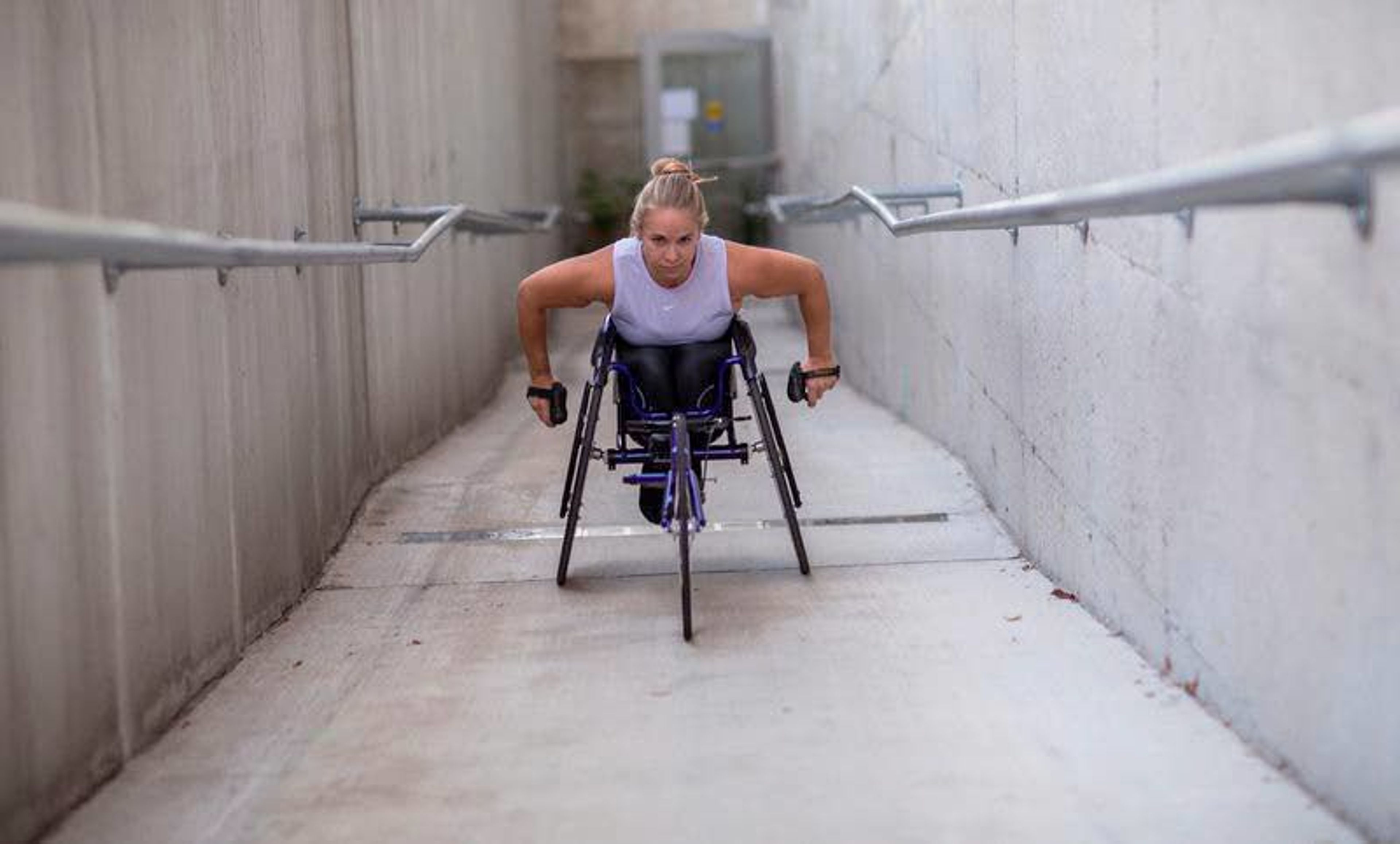 Arielle Rausin, 26, practices Oct. 3 at the National Training Center for Wheelchair Track at the University of Illinois in Champaign. She’ll compete in the Chicago Marathon today.