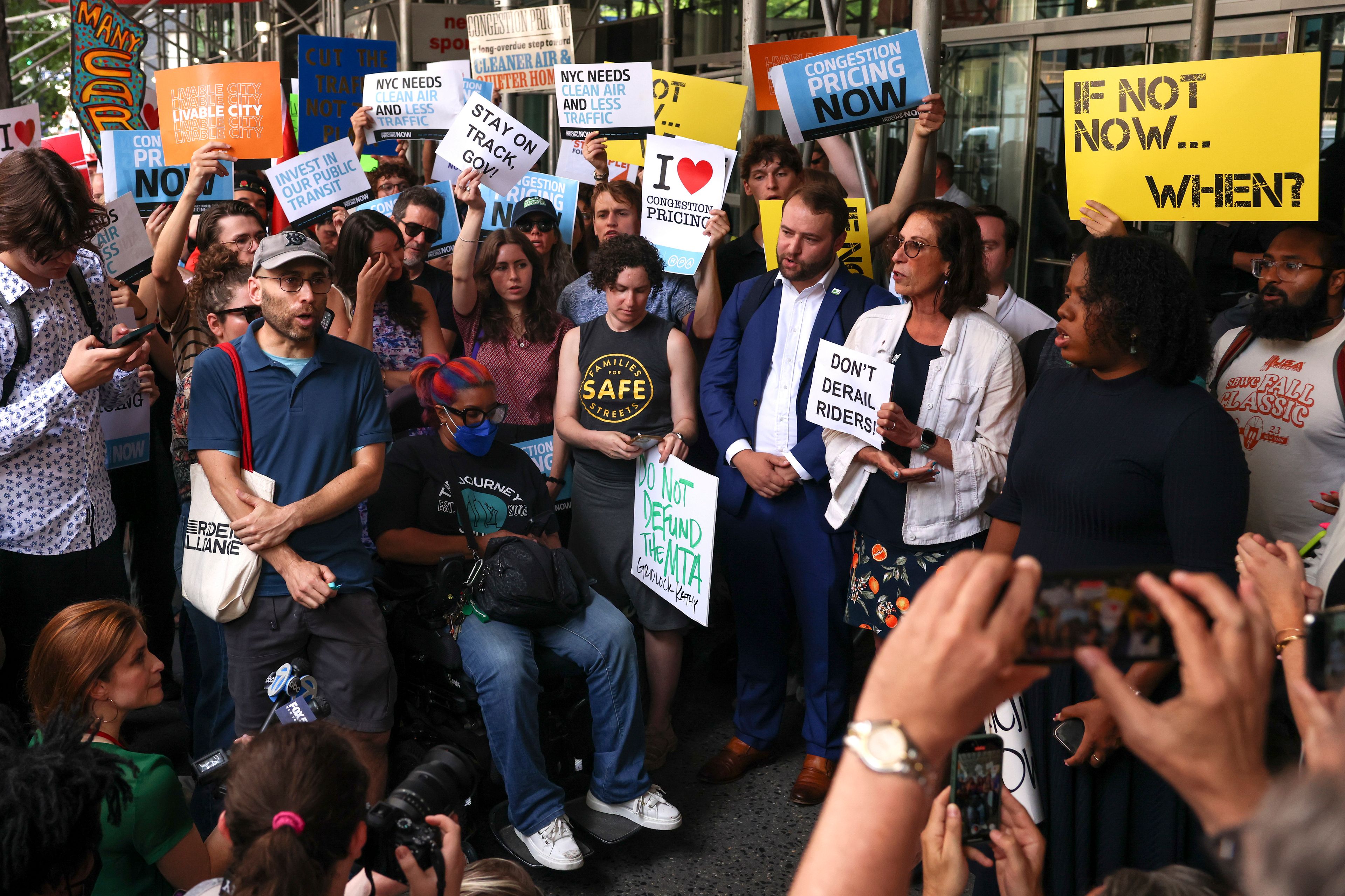 Protesters demonstrate outside New York Gov. Kathy Hochul's Manhattan office, Wednesday, June 5, 2024, in New York. Hochul is indefinitely delaying implementation of a plan to charge motorists big tolls to enter the core of Manhattan, just weeks before the nation's first "congestion pricing" system was set to launch.