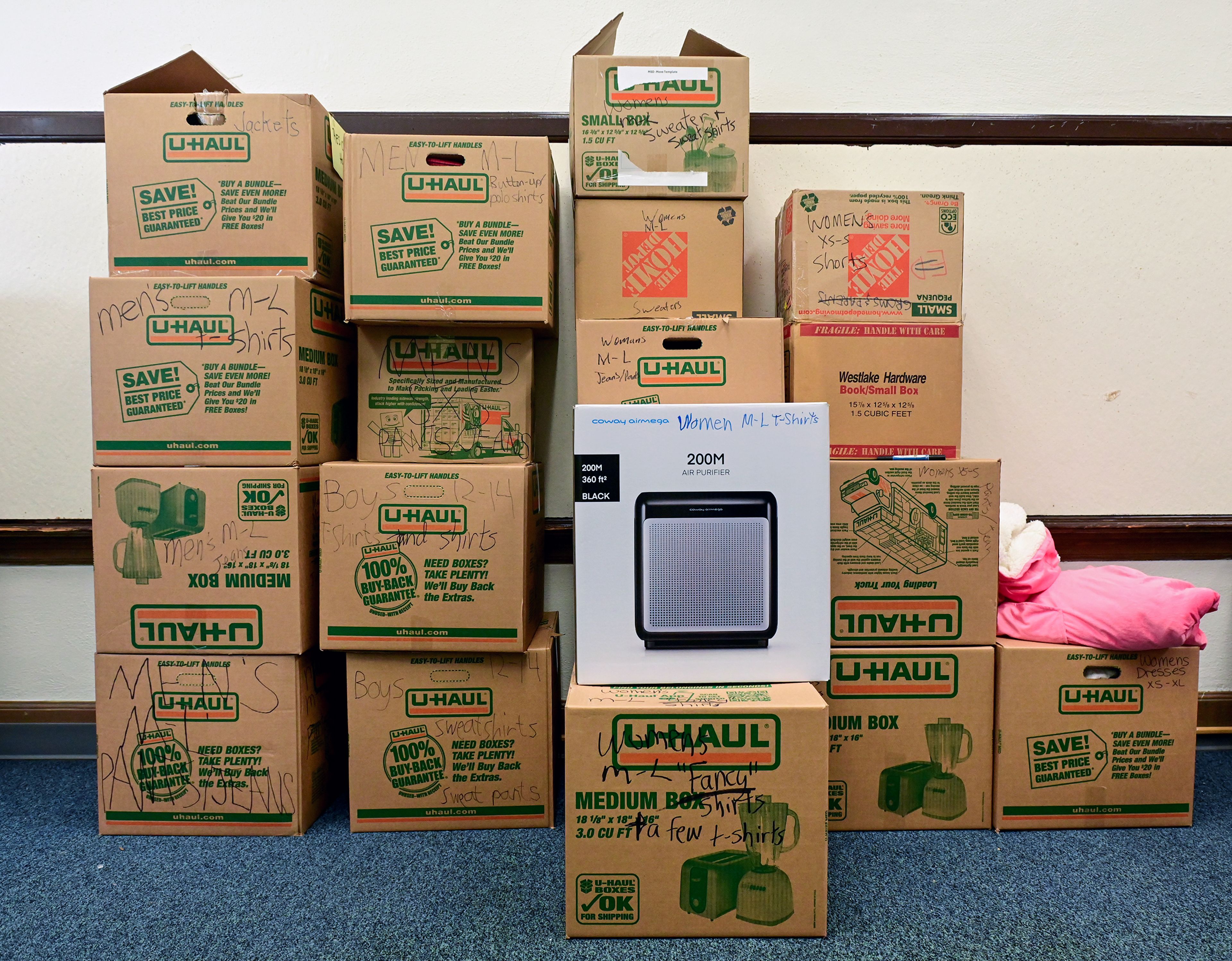 Surplus clothes are cleaned, organized and stored in boxes in a room connected to the Moscow School District Family Resource Hub in the Russell Elementary building Thursday in Moscow.,