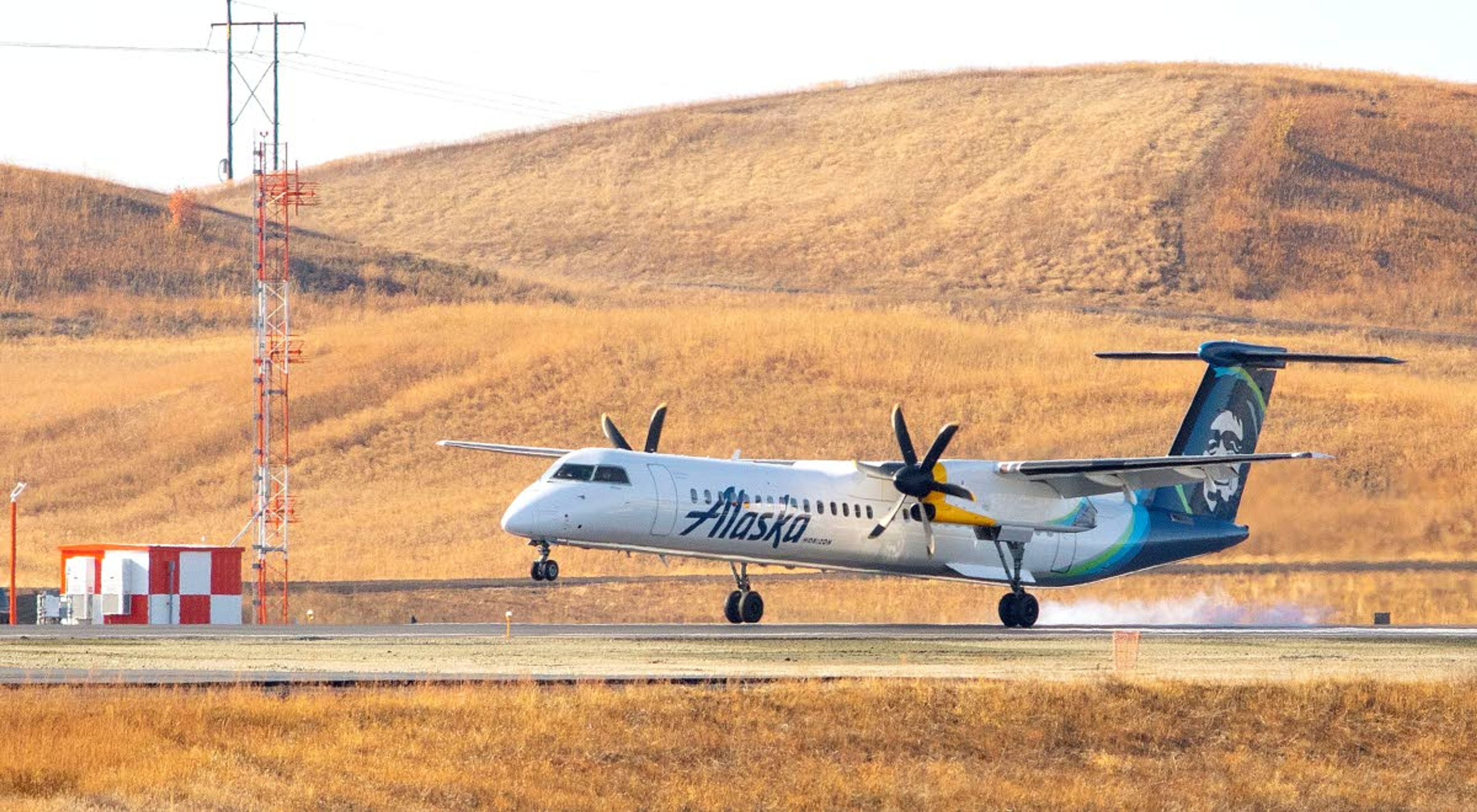 An Alaska Airlines plane lands before a ribbon-cutting ceremony for a new runway Thursday at the Pullman-Moscow Regional Airport.