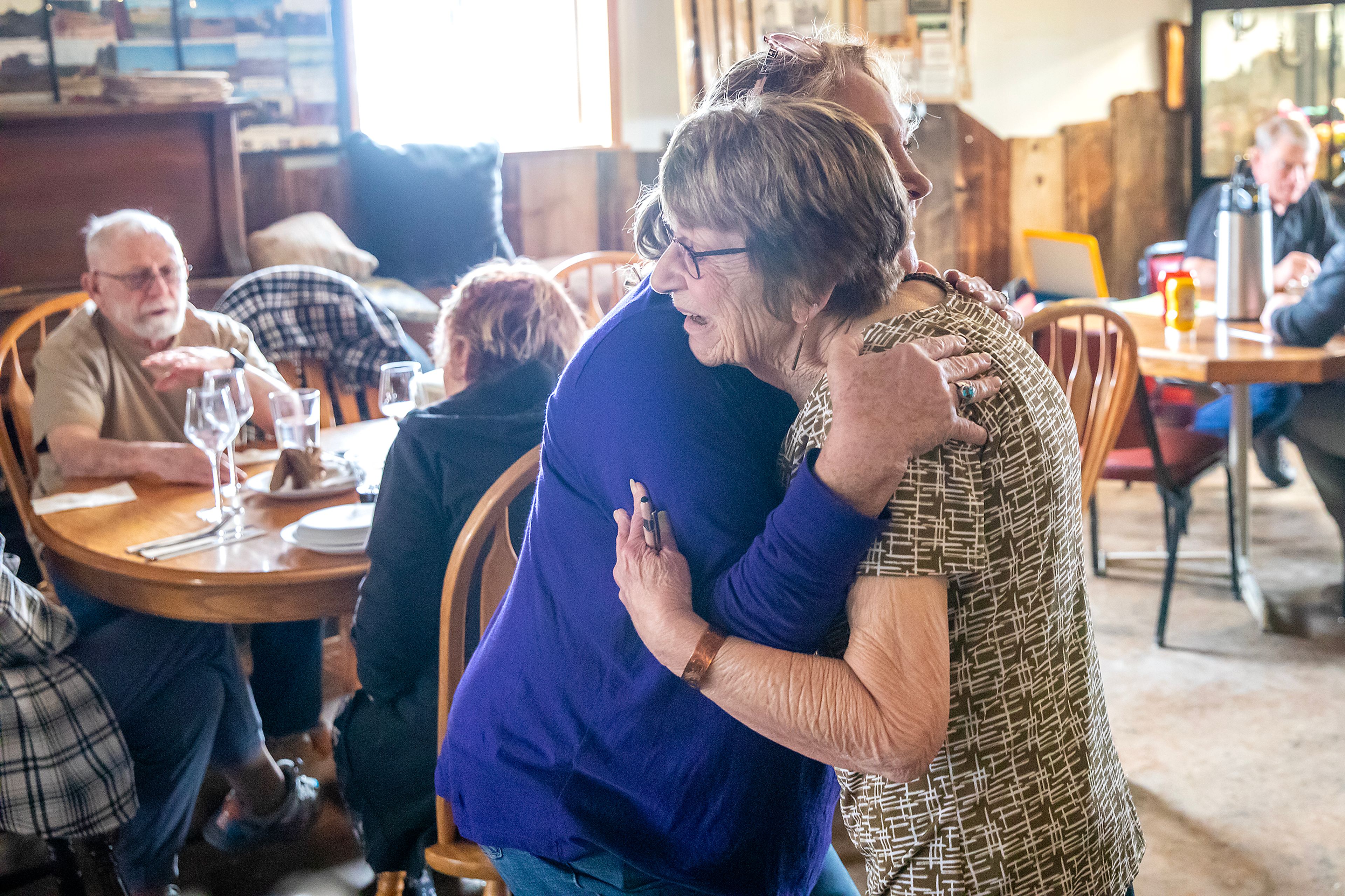 Linda Elliott hugs Judy Stapleton Thursday at the Keuterville Pub & Grub.