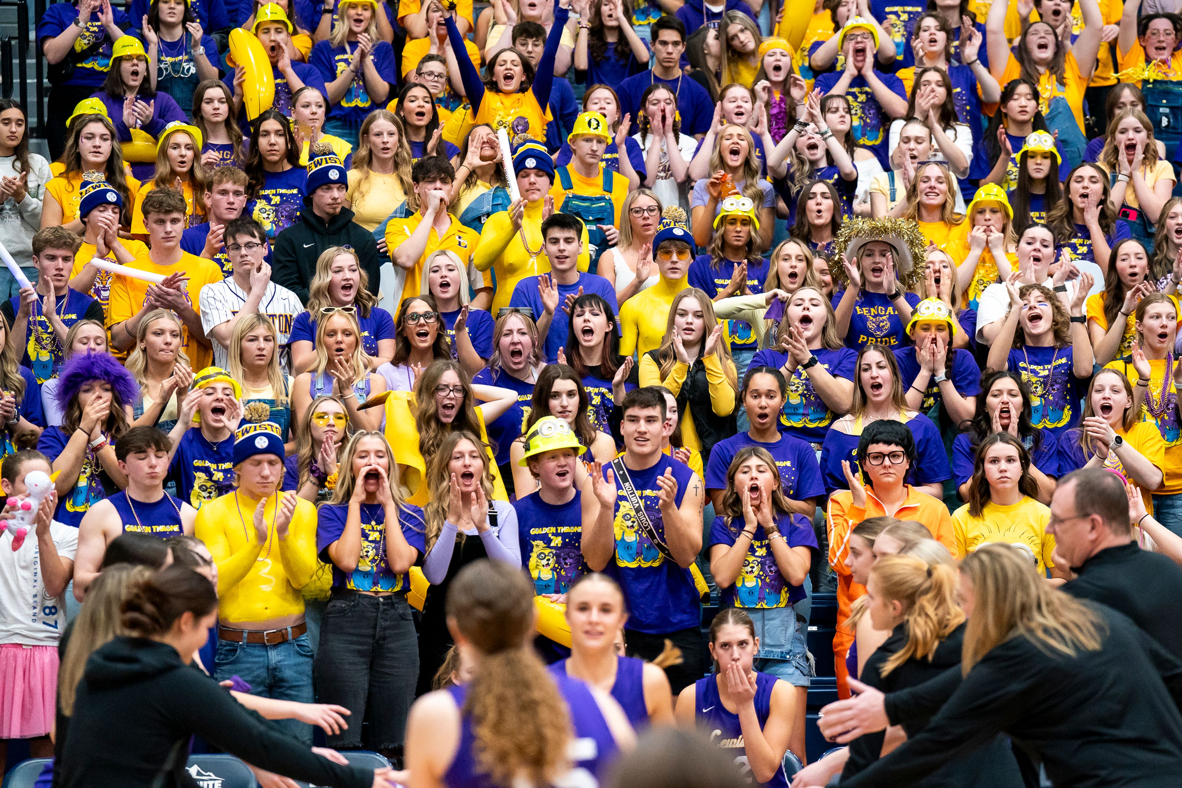 The Lewiston High School student section cheer as the girls basketball team starters are announced before their Golden Throne rivalry game against Clarkston on Friday inside the P1FCU Activity Center in Lewiston.