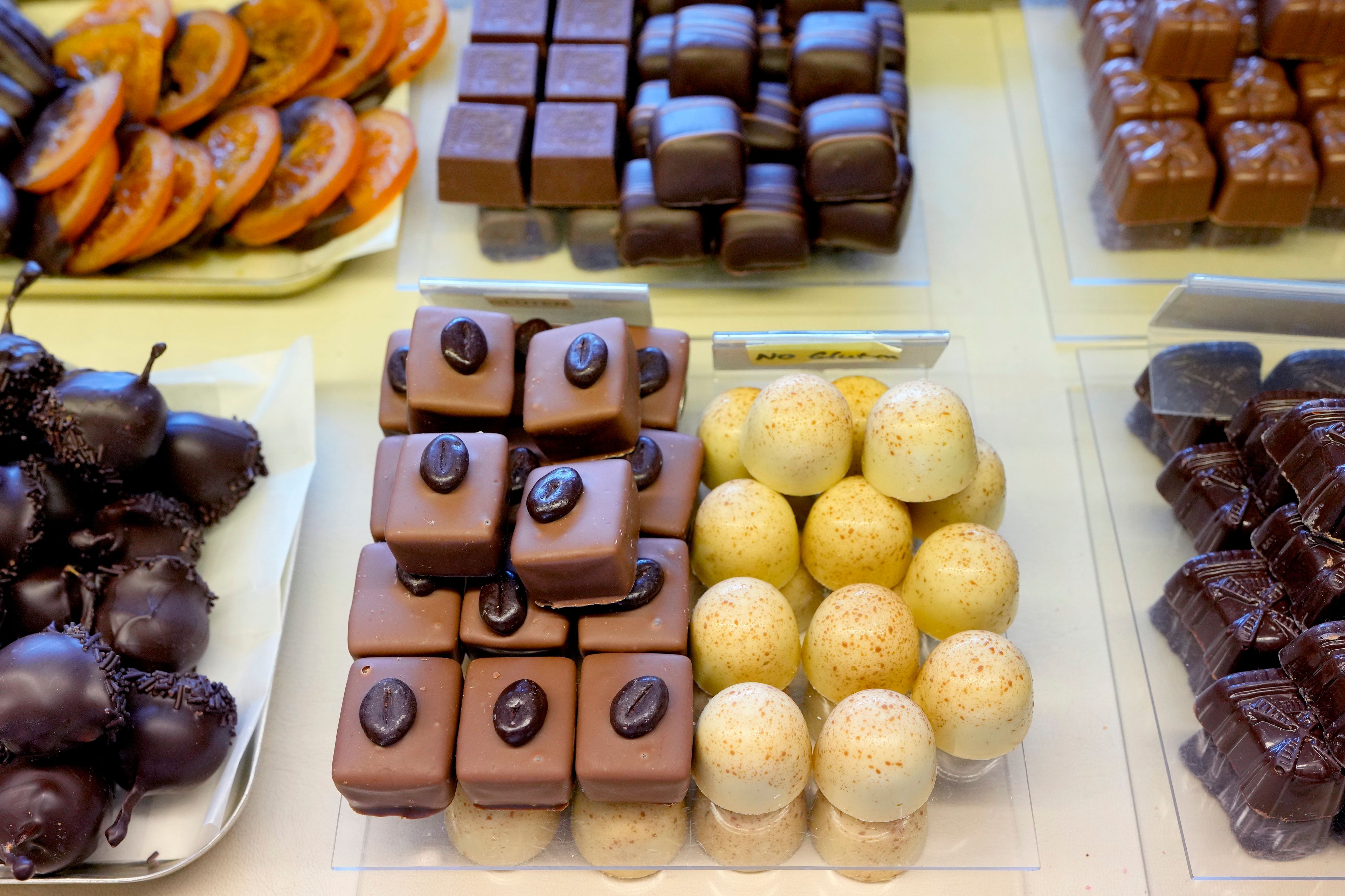 Luxury handmade Belgian Chocolates are seen displayed at Sandrine a chocolate shop owned by Niaz Mardan, in south west London, Thursday, March 21, 2024. Niaz Mardan, is suffering due to high cocoa prices, she's making no profits and fears she will have to close the shop that's been around for 25 years (she's the third owner and took over in 2019). (AP Photo/Kirsty Wigglesworth)